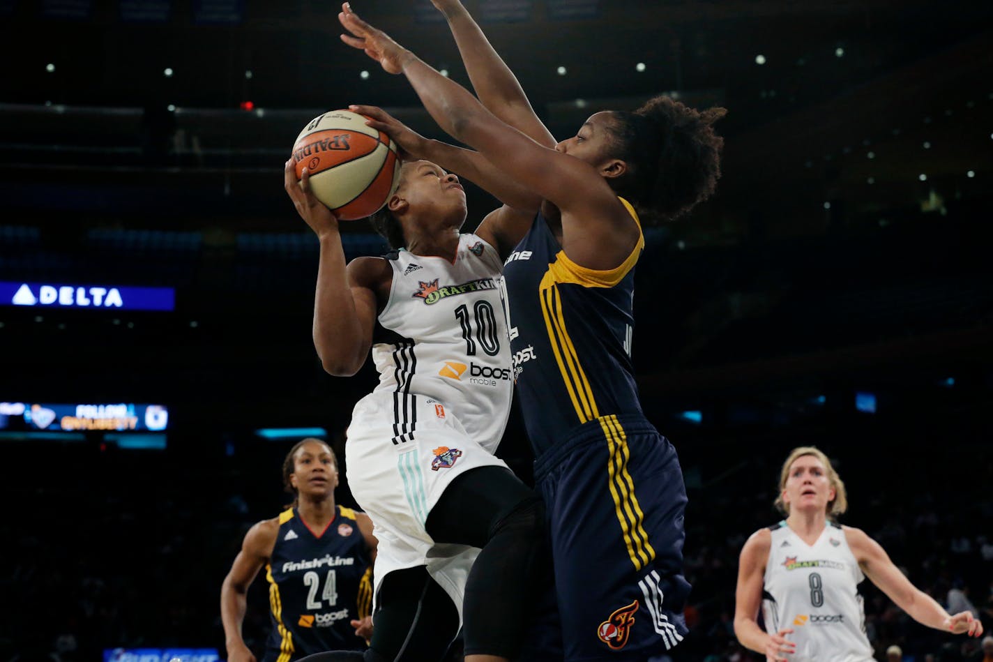 New York Liberty guard Epiphanny Prince (10) goes to the basket against Indiana Fever guard Shenise Johnson during the second half of Game 1 of the WNBA Eastern Conference finals, Wednesday, Sept. 23, 2015 at Madison Square Garden in New York. The Liberty won 84-67.