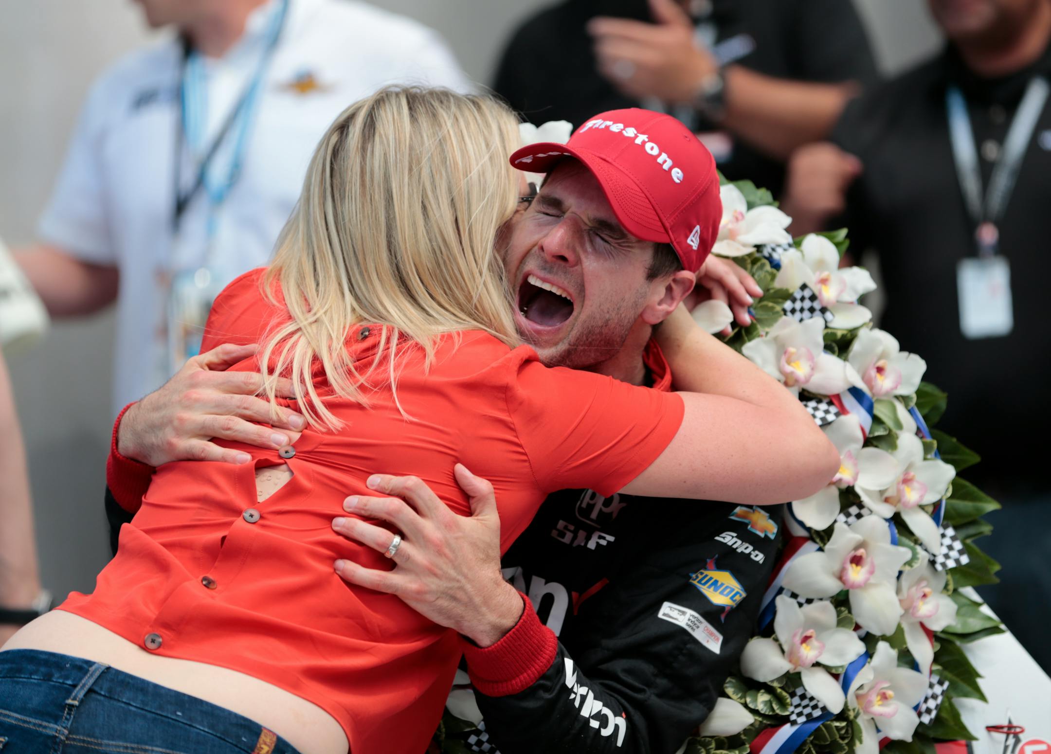 Will Power (shown hugging his wife, Liz, after winning the 2018 Indianapolis 500) won for the second time in three races by taking the checkered flag at Portland (Ore.) International Raceway on Sunday.