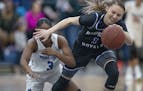 Hopkins&#x2019; Paige Bueckers, battled for the ball against Minnetonka&#x2019;s Desiree Ware in a game at the Lindbergh Center, Friday, February 21, 