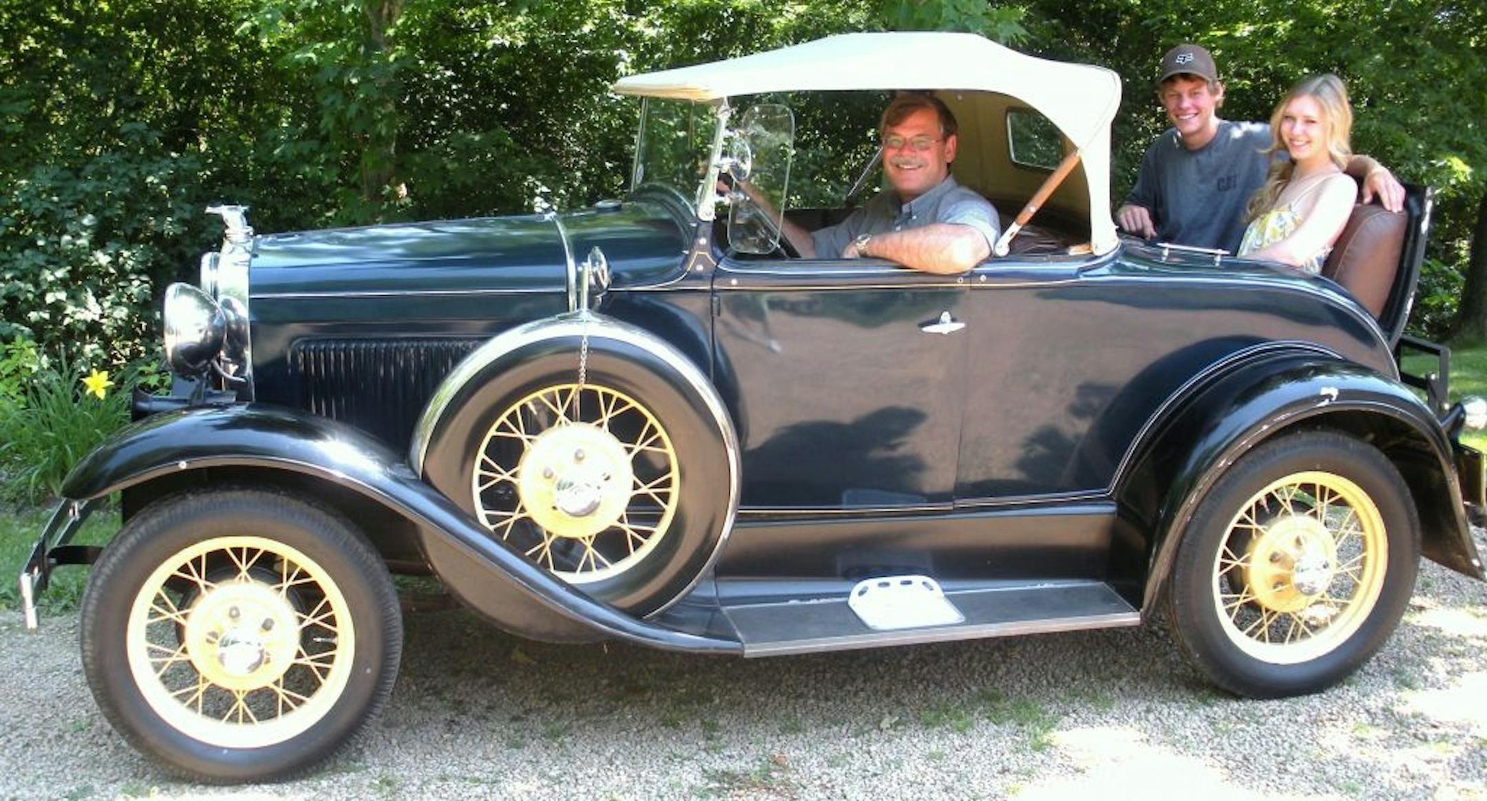 Photo by Jerry Goodrich
Dr. Scott Carlson of Prior Lake prepares to take rumble-seat passengers David Parks and Emily Krueger on a jaunt in his 1930 Model A Ford.