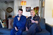 Rob Kirby, left, author of the graphic memoir “Marry Me a Little,” with his husband and longtime partner John Capecci.