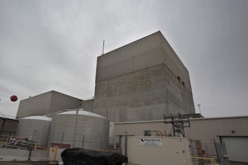 The gray concrete walls of the Monticello nuclear power plant, 40 miles north of the Twin Cities. The upper third of the building is not hardened like