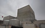 The gray concrete walls of the Monticello nuclear power plant, 40 miles north of the Twin Cities. The upper third of the building is not hardened like