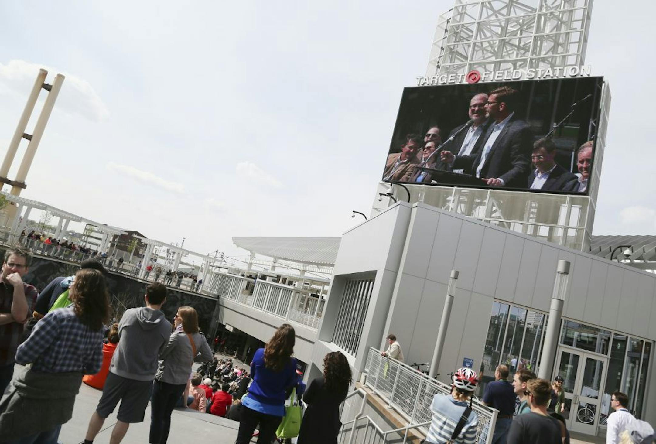 State Sen. Scott Dibble is seen on a large video screen during the dedication of the Target Field Station Saturday, May 18, 2014, in Minneapolis, MN.