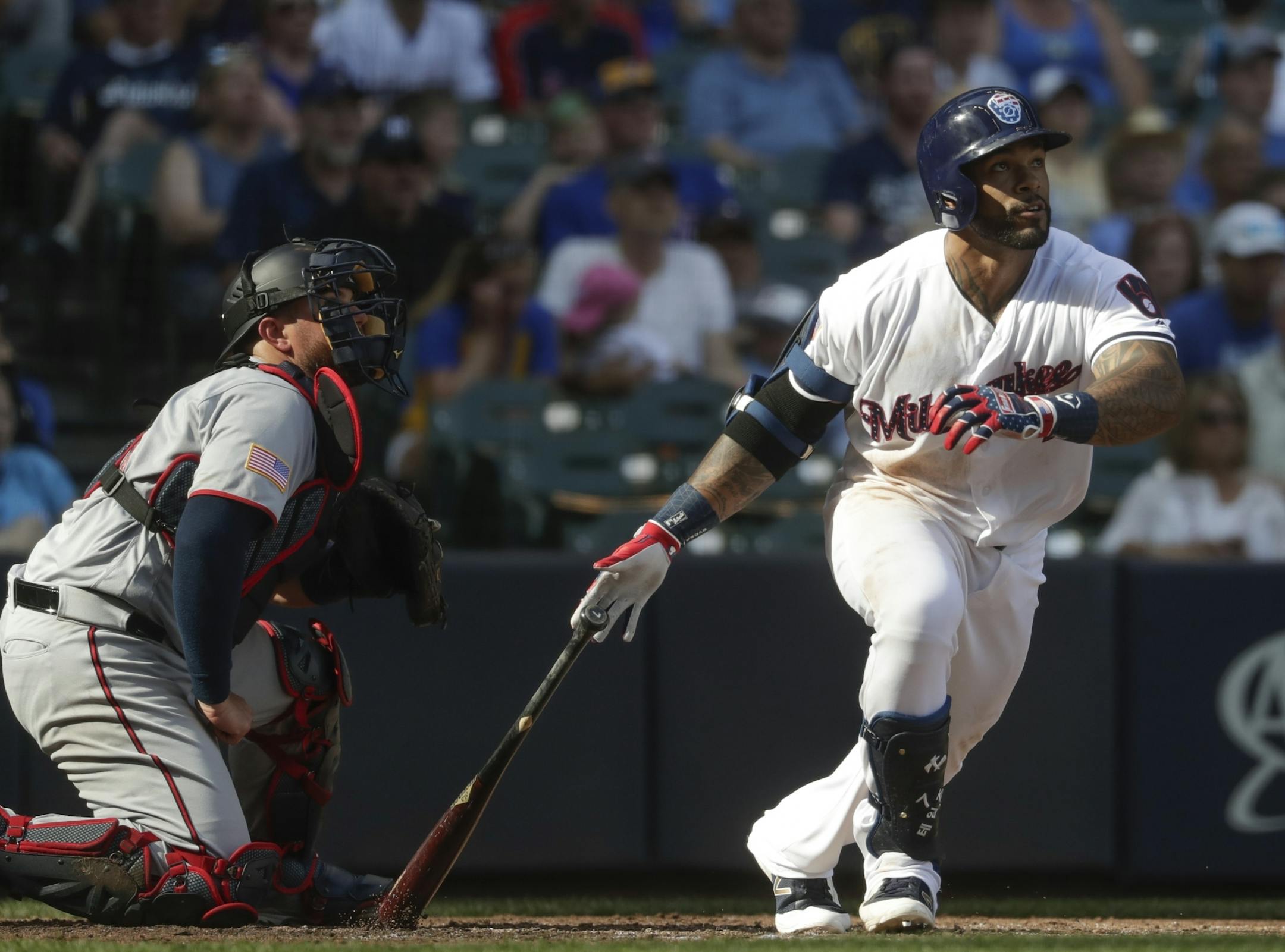 Milwaukee Brewers' Eric Thames hits a two-run home run during the fifth inning of a baseball game against the Minnesota Twins Tuesday, July 3, 2018, in Milwaukee.