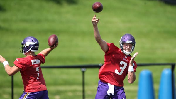 Quarterbacks Case Keenum, left, and Mitch Leidner threw passes during a Vikings practice in August.