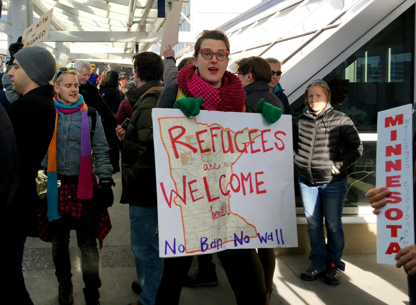 Protesters gather on Sunday at MSP Airport to protest the travel ban.