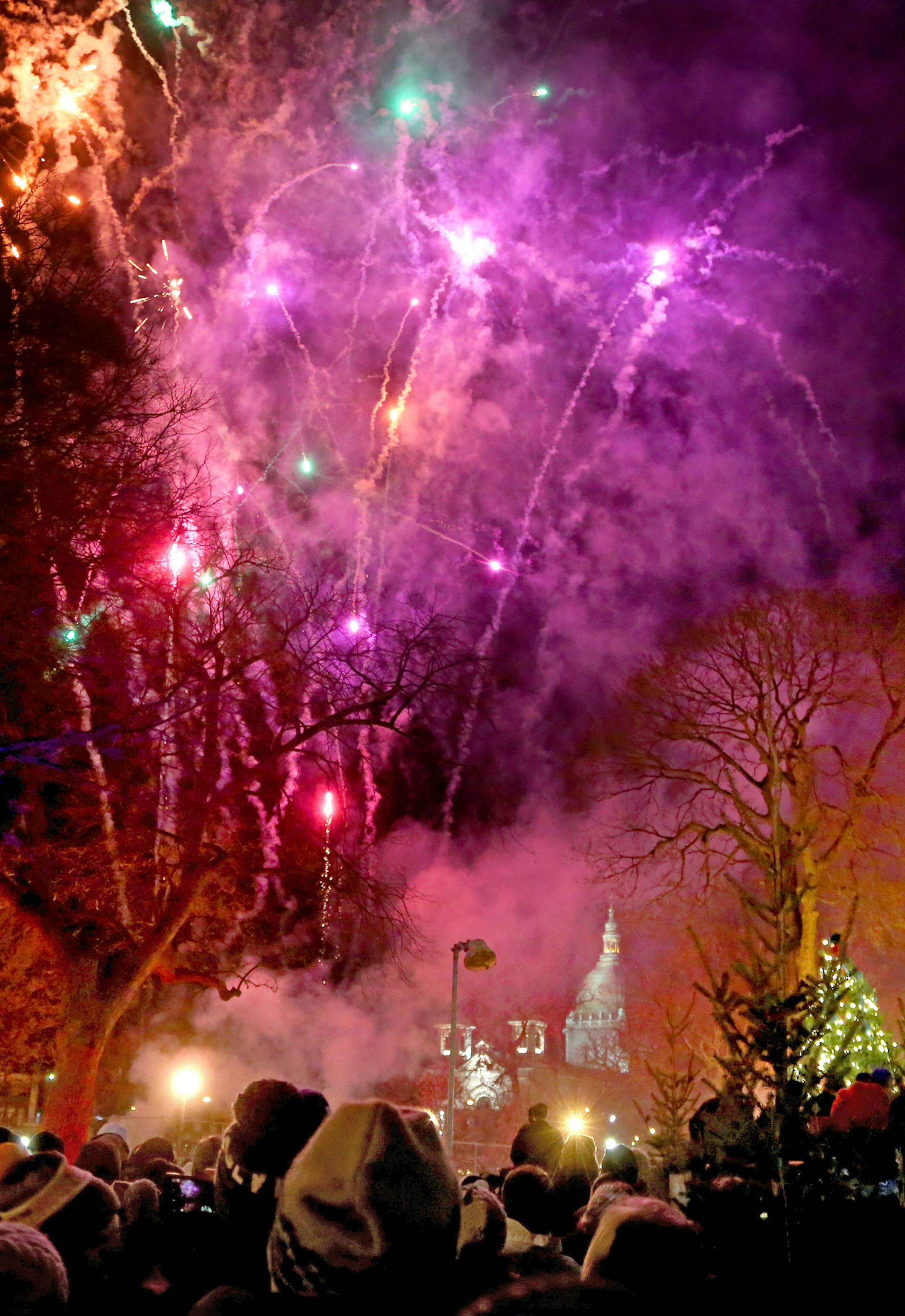 Holidazzle kicked off tonight for the holiday season at Loring Park with fireworks Friday, Nov. 27, 2015, in Minneapolis, MN. Behind the park and fireworks is Basilica of St. Mary.](DAVID JOLES/STARTRIBUNE)djoles@startribune.com Holidazzle kicked tonight for the holiday season with fireworks at Loring Park Friday, Nov. 27, 2015, in Minneapolis, MN. ORG XMIT: MIN1511271931231162