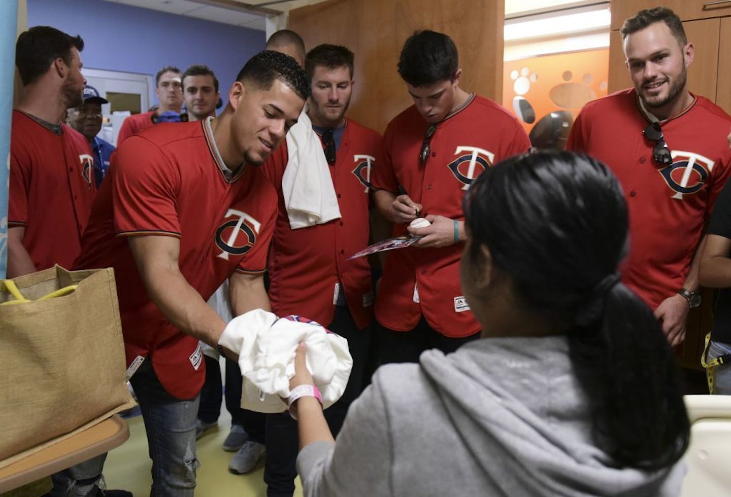 Minnesota Twins starting pitcher Jose Berrios leads a group of his Twins teammates during a visit to the San Jorge Children's Hospital in San Juan