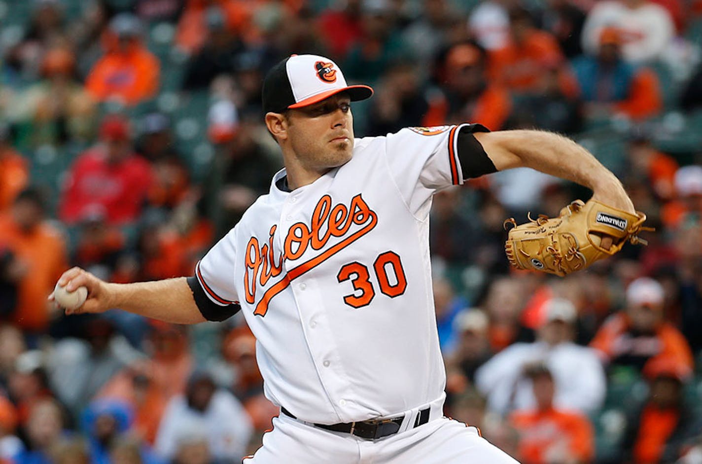 Baltimore Orioles starting pitcher Chris Tillman throws to the Minnesota Twins in the first inning of an opening day baseball game in Baltimore, Monday, April 4, 2016. (AP Photo/Patrick Semansky)