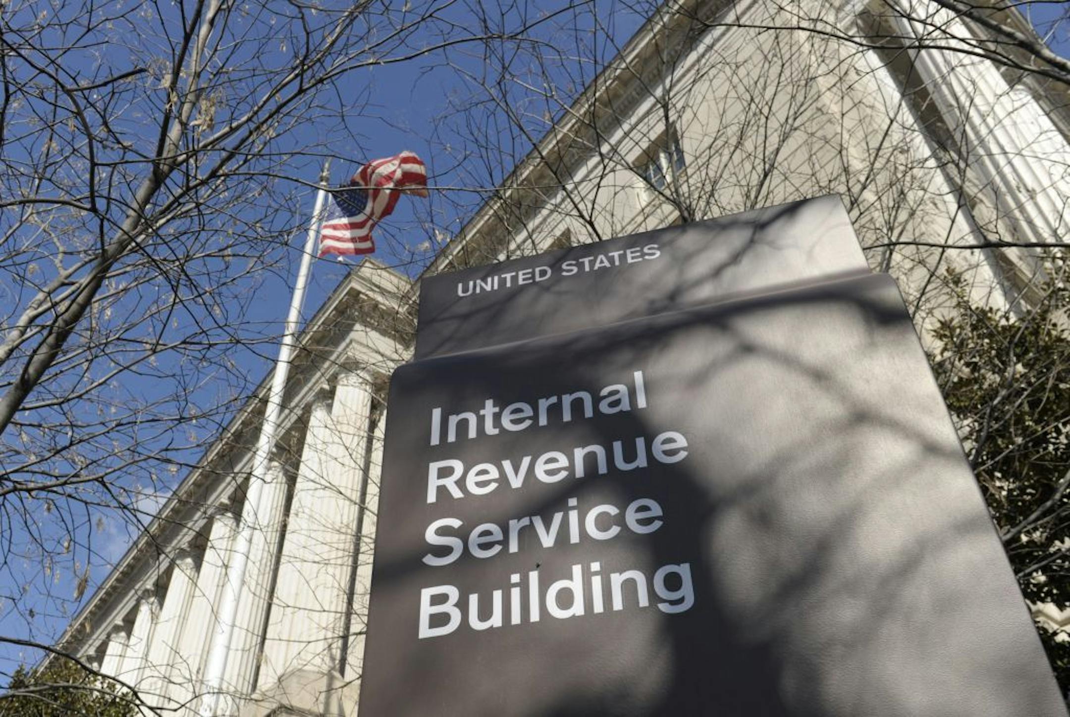 FILE - This March 22, 2013, file photo, shows the exterior of the Internal Revenue Service building in Washington. The Internal Revenue Service has recouped more than $5.5 billion under a series of programs that offered reduced penalties and no jail time to people who voluntarily disclosed assets they were hiding overseas, government investigators said Friday, April 26, 2013. In all, more than 39,000 tax cheats have come clean under the programs.