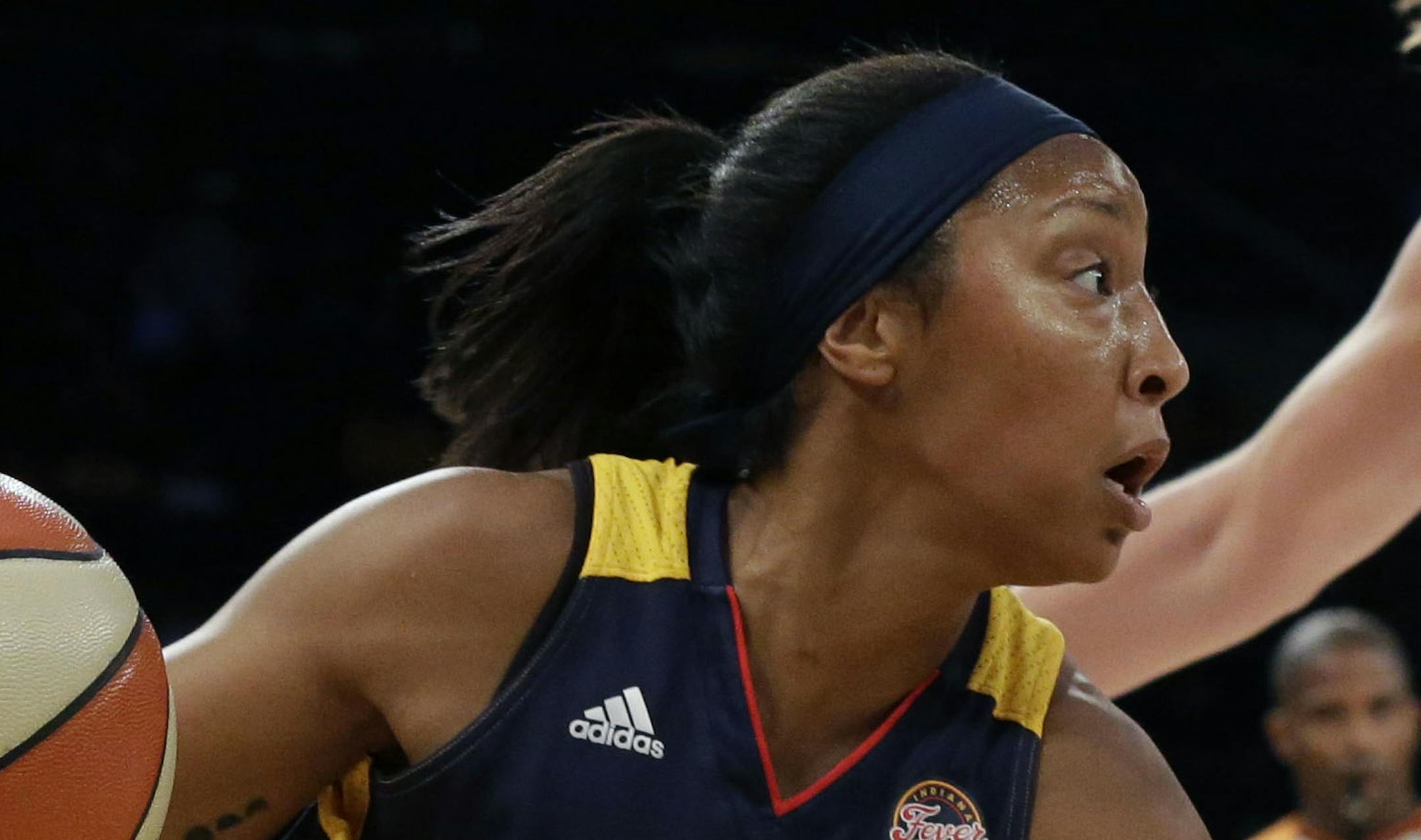 Indiana Fever guard Briann January (20) drives to the basket past New York Liberty center Carolyn Swords (8) during the first half of Game 1 of the WNBA basketball Eastern Conference finals, Wednesday, Sept. 23, 2015 at Madison Square Garden in New York. (AP Photo/Mary Altaffer)