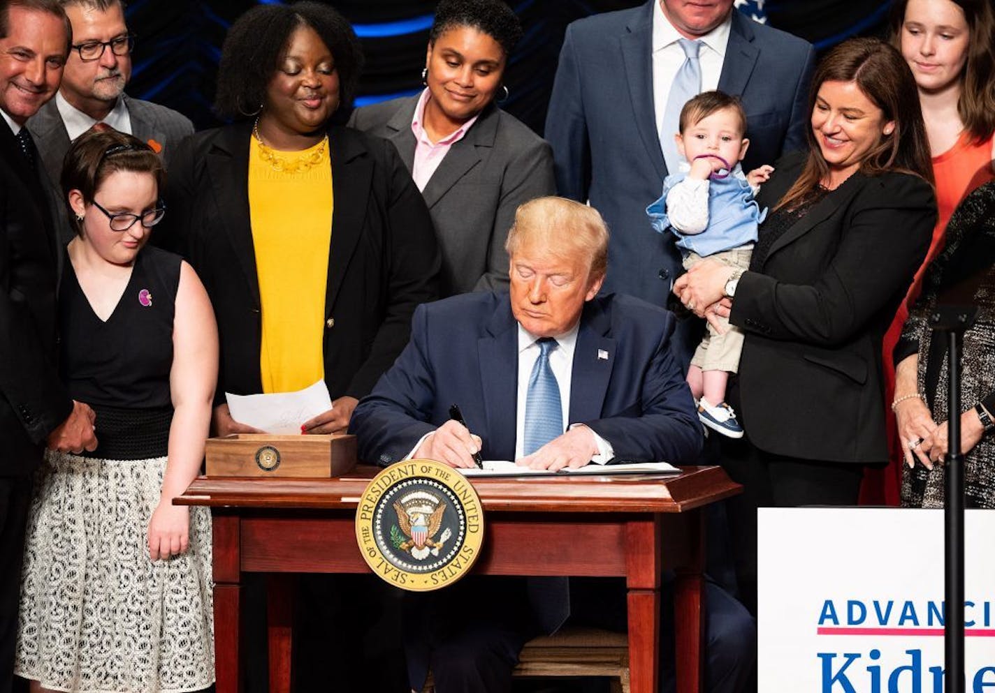 President Donald Trump signs an executive order to advance kidney health, at the Ronald Reagan Building and International Trade Center in Washington, D.C., on Wednesday, July 10, 2019.