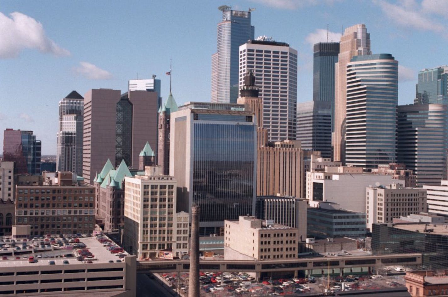 A southwest veiw of downtown Minneapolis and the new Federal Building, United States Courthouse (bottom left with dark windows) . The plaza is on the opposite side of this view facing City Hall.