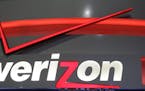 FILE - In this April 7, 2013, file photo, the Verizon studio booth at MetLife Stadium in East Rutherford, N.J. Verizon has agreed to buy online portal
