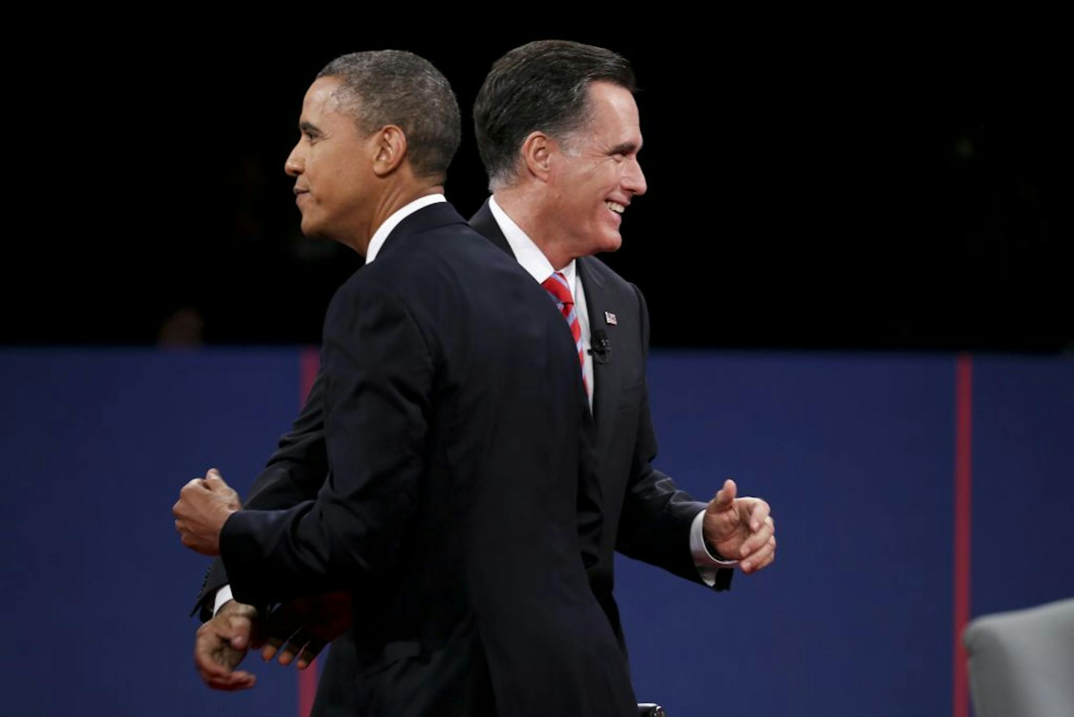 President Barack Obama and the Republican presidential candidate, Mitt Romney, shake hands after the presidential debate at Lynn University in Boca Raton, Fla., Oct. 22, 2012.
