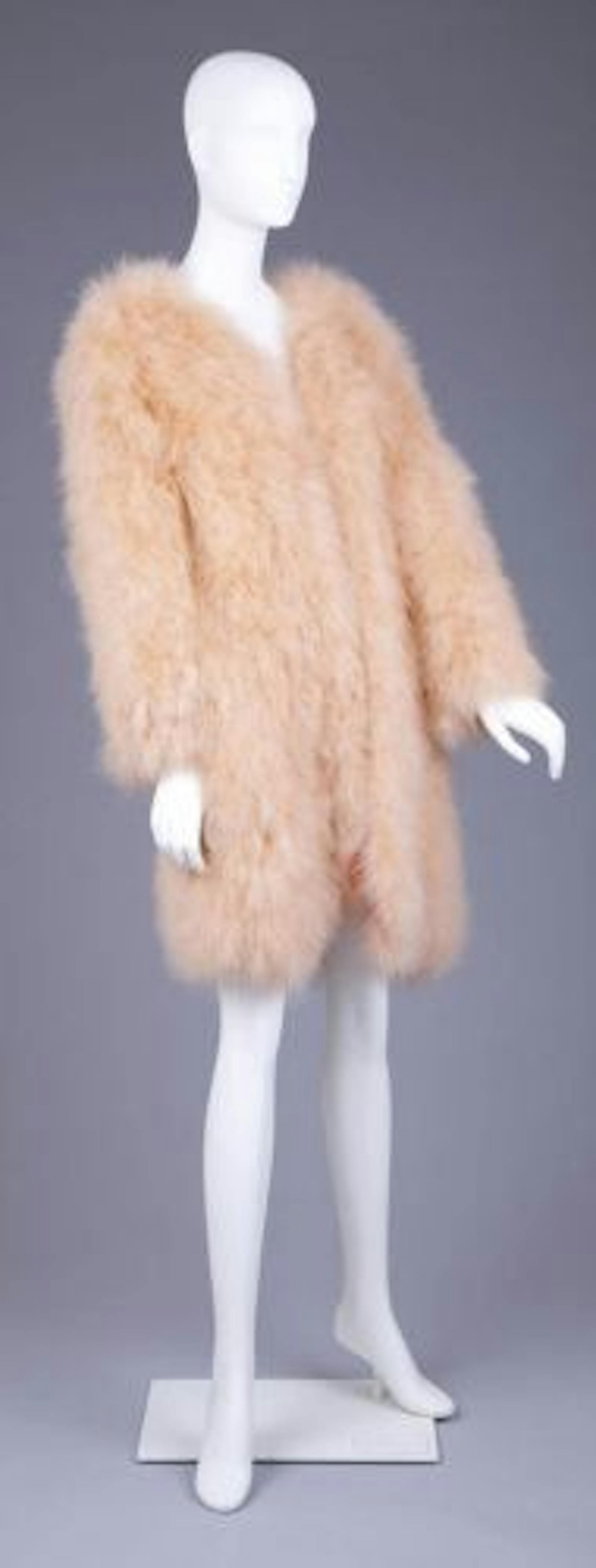 This peach feathered coat from France, by Sonia Rykiel, was made circa 1970-75.