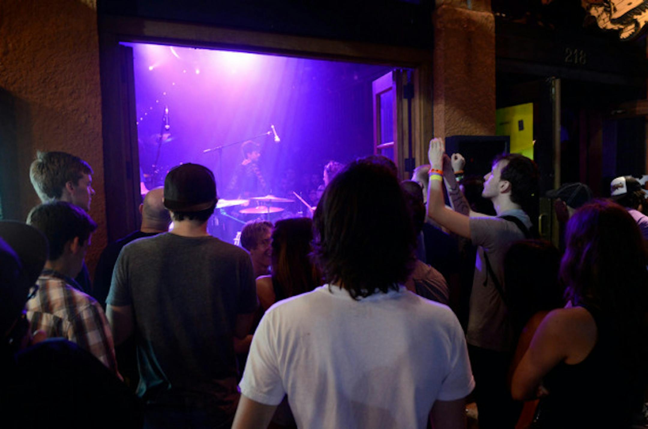 Fans watched Polica from outside the Bat Bar on Sixth Street.