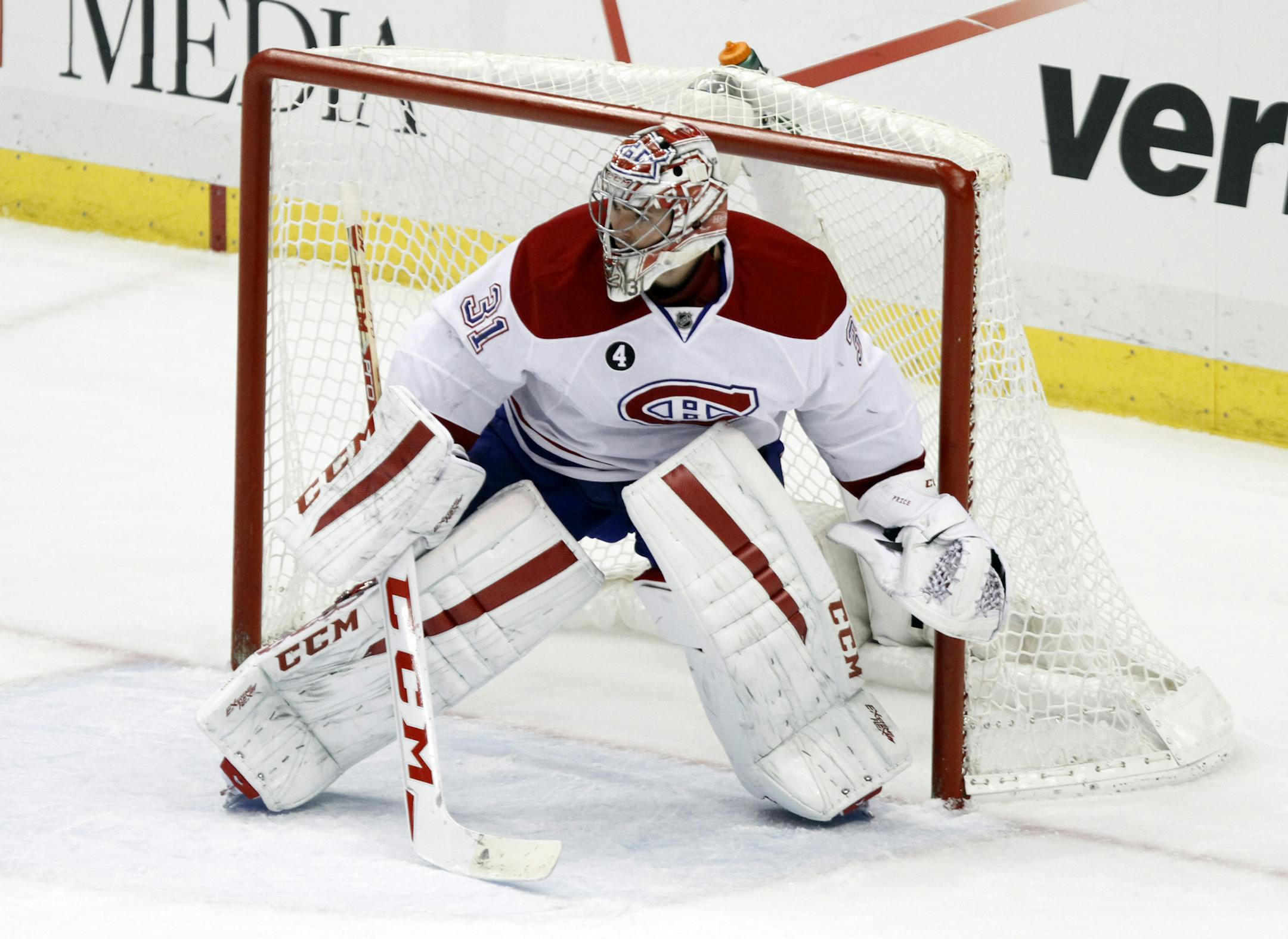 Montreal Canadiens goalie Carey Price (31) tends the net agaisnt the Pittsburgh Penguins during the third period of an NHL hockey game in Pittsburgh Saturday, Jan. 3, 2015.(AP Photo/Tom E. Puskar)
