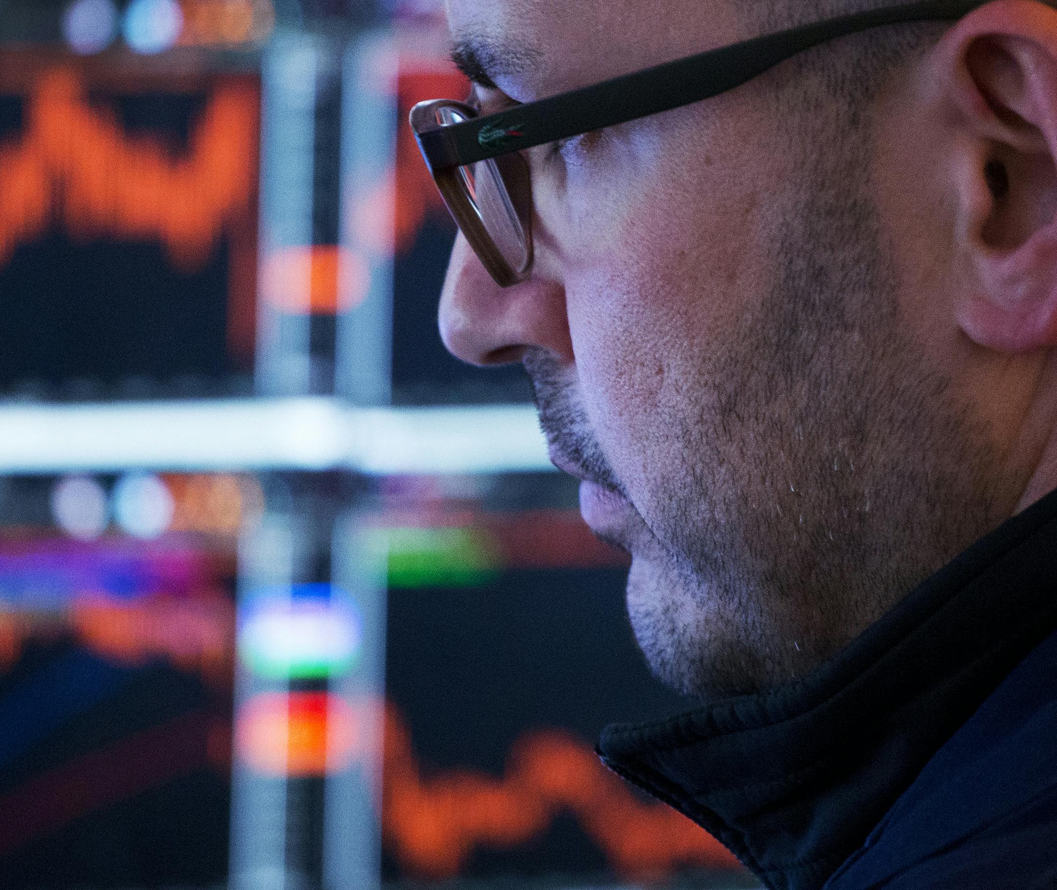 FILE - In this Monday, Jan. 9, 2017, file photo, a trader works at the New York Stock Exchange. Thereís still time to slash your tax burden, boost your retirement savings and get a head start on investing wisely in 2018. One tip is to spend some time reviewing your portfolio. The end of the year is a good time to check your portfolioís diversification among assets, such as stocks and bonds, and categories within each. (AP Photo/Mark Lennihan, File)