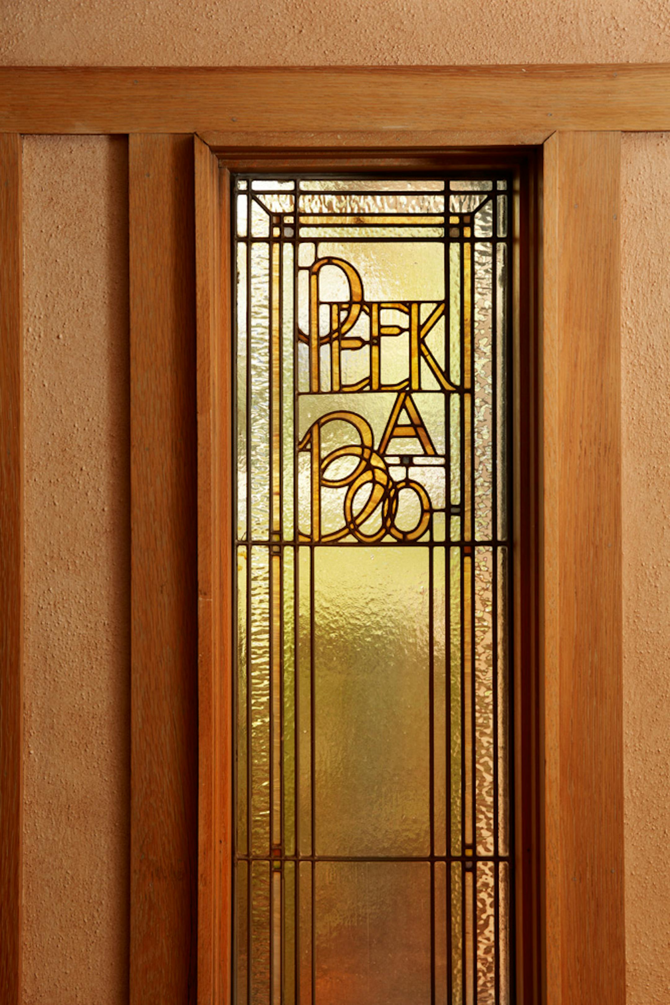 Purcell-Cutts House, 2328 Lake Place, Minneapolis, Minnesota, 1913, William Gray Purcell, Architect.George Elmslie, George Feick Jr. partners in firm Purcell, Feick and Elmslie, Edna S. Purcell House, Prarie School Style, Open floor plan, Art Glass windows, Writing Nook, Fireplace wall Mural by Charles Livingston Bull, Louisana Herons Flying with two Moons, Iridescent glass mortered in frieplace base, Stencil pattern, Peak a Book stained glass entry, Grandfather Gray portrait by Lawton Parker in Entrance Hall, Dining room Art Glass double door to screend-in Porch, Reflecting Pool and landscape designed by Harry Franklin Baker, Living room, Stair Hall, Master Suite, Sleeping Porch, Built in cedar floor storage, fireplace, childrens room connected to master with accordian style operating partition, sunken Living room,tent Ceilings, Ceiling Lights and art glass by Mosaic Art Shops Minneapolis, Maid Call Button, Air conditioning, Central vacuum system, sliding kitchen door operated by foot button, icebox in kitchen with door to outside, custom Sitting chair, Custom Floor lamp, Custom Dining room table,chairs and sideboard, Custom Cluster Pendant lighting, Oak hardwood floors and trim, Custom Throw rugs, Continuous tented roof and ceiling, Elevated dining room, dropped floor living room, "Little Joker", Personalized home with monogram ESP for Edna S. Purcell,