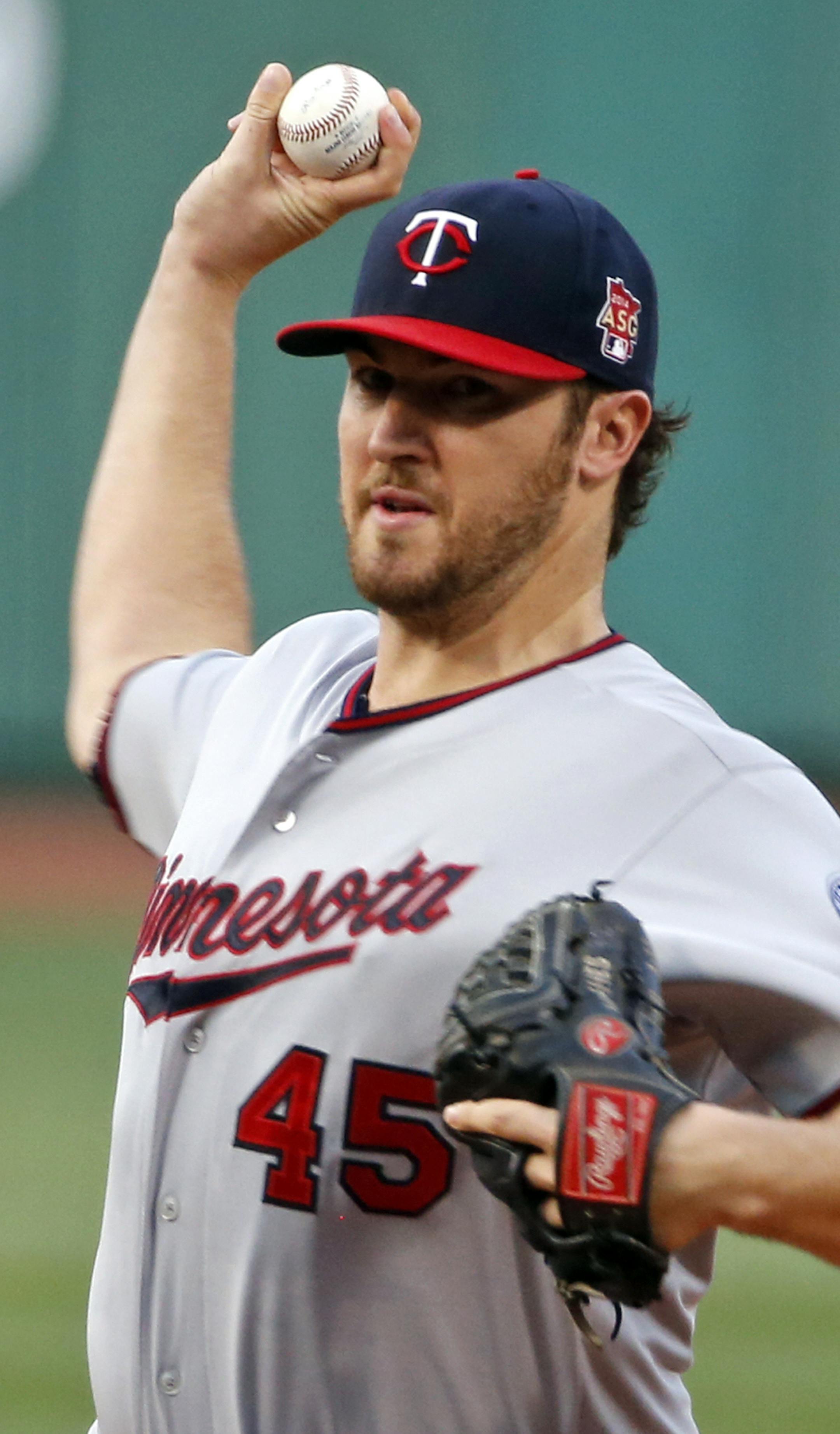 Minnesota Twins starting pitcher Phil Hughes fires one in against the Boston Red Sox in the first inning of a baseball game at Fenway Park in Boston, Tuesday, June 17, 2014. (AP Photo/Elise Amendola)