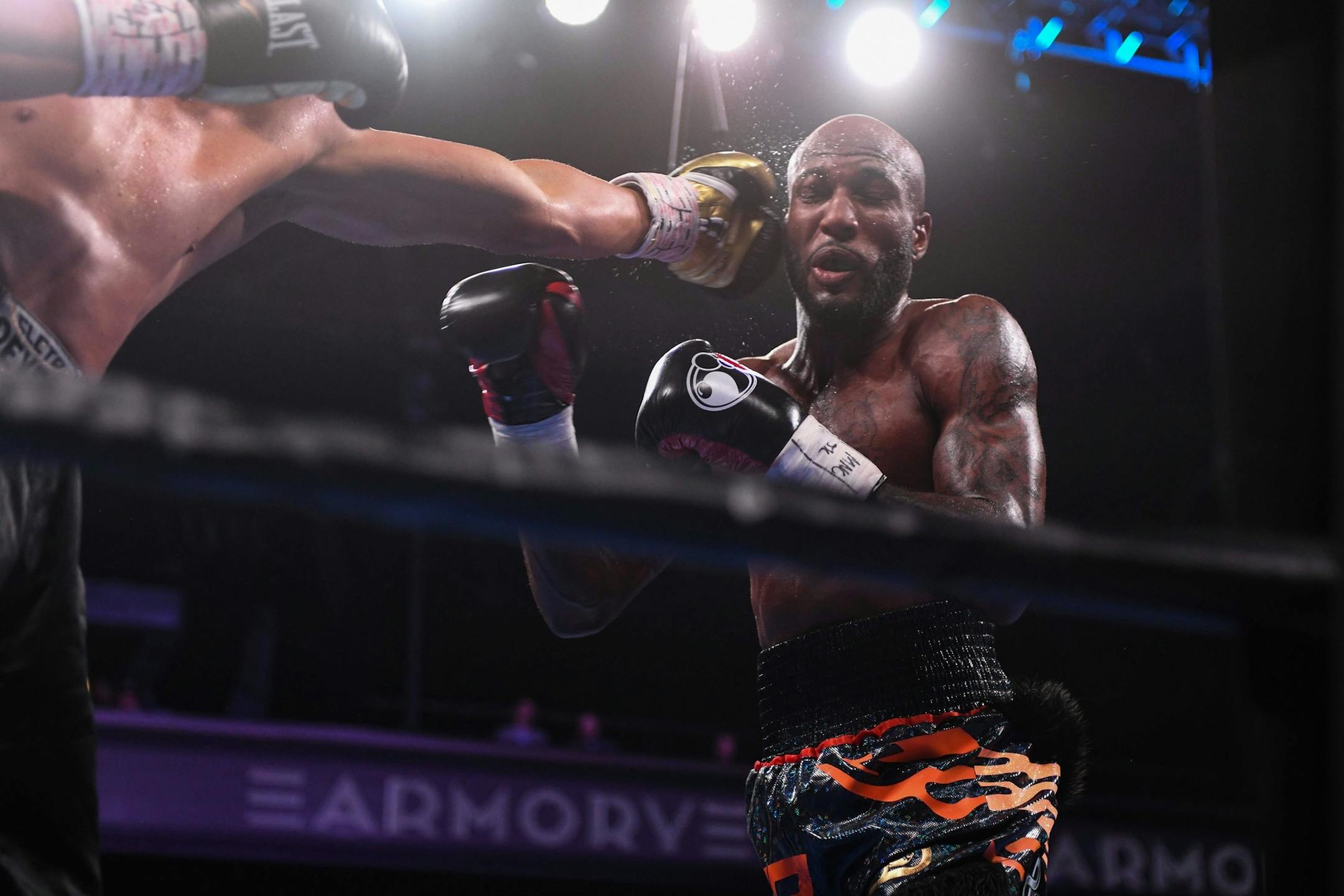 Darwin Price took a hit from Yakubu Amidu during their welterweight match.