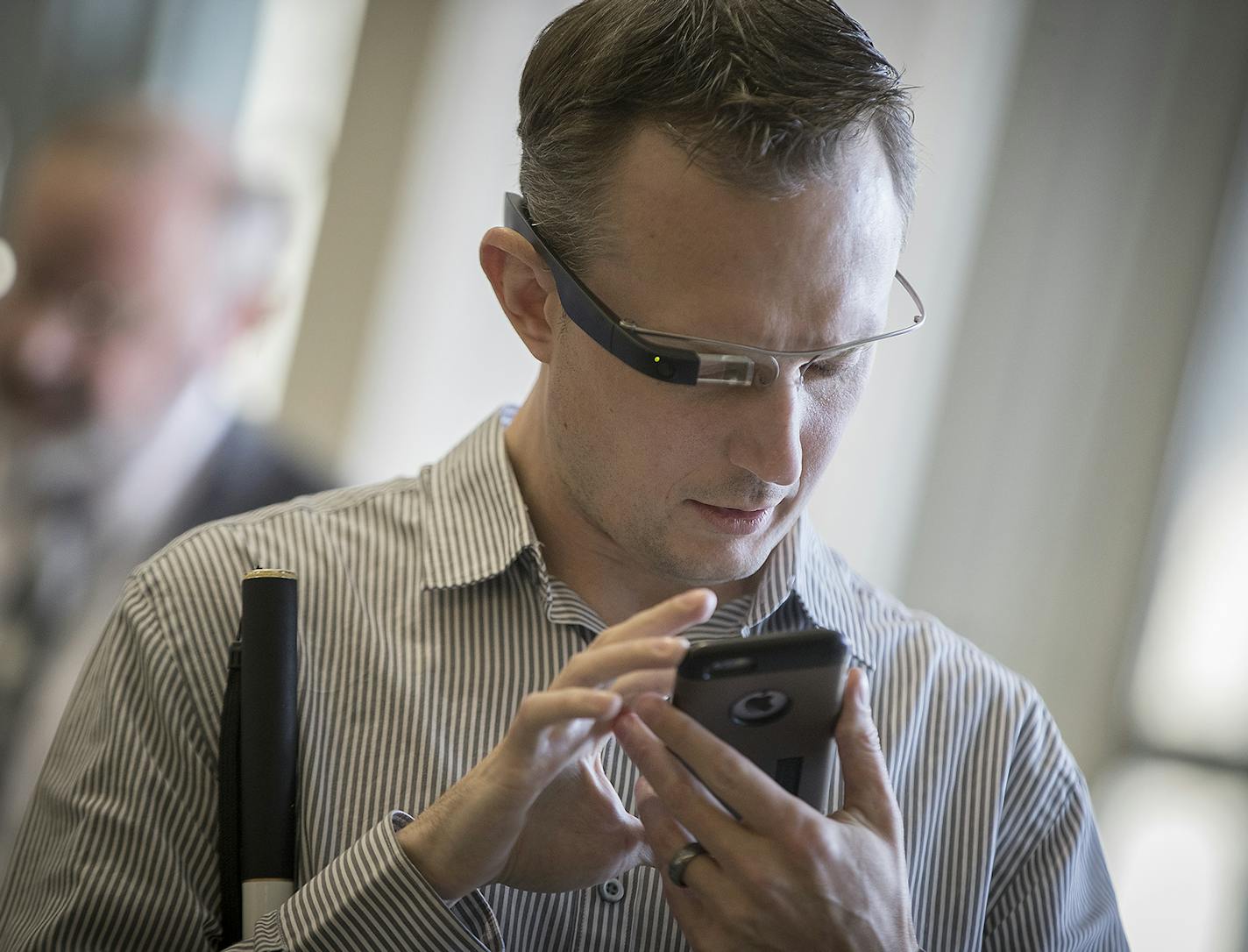 Greg Stilson, who is visually impaired, used a visual interpreting device before a press conference regarding its use at the MSP Airport, Wednesday, January 3, 2018 in Bloomington, MN. MSP will offer the service free starting Wednesday as part of its goal of being one of the most accessible airports in the nation. ] ELIZABETH FLORES &#xef; liz.flores@startribune.com