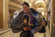 Former Minn. Governor Jesse Ventura talks to reporters after a meeting with Governor-elect Tim Walz inside the state Capitol in St. Paul, Minn., on Tu
