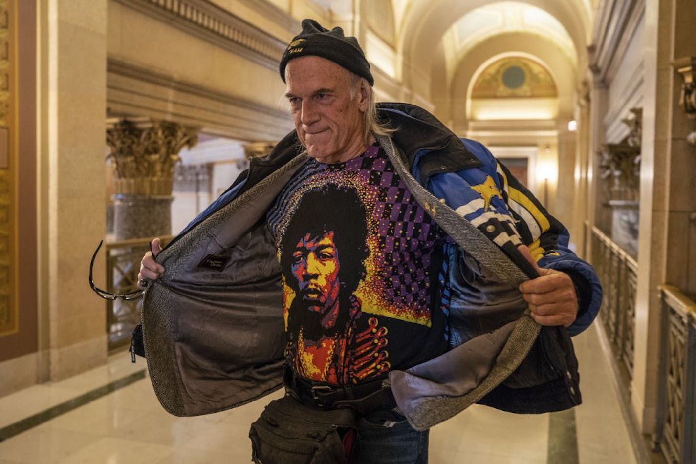 Former Minn. Governor Jesse Ventura talks to reporters after a meeting with Governor-elect Tim Walz inside the state Capitol in St. Paul, Minn., on Tuesday, Nov. 13, 2018. "I'm 67 with a six pack," Ventura said.