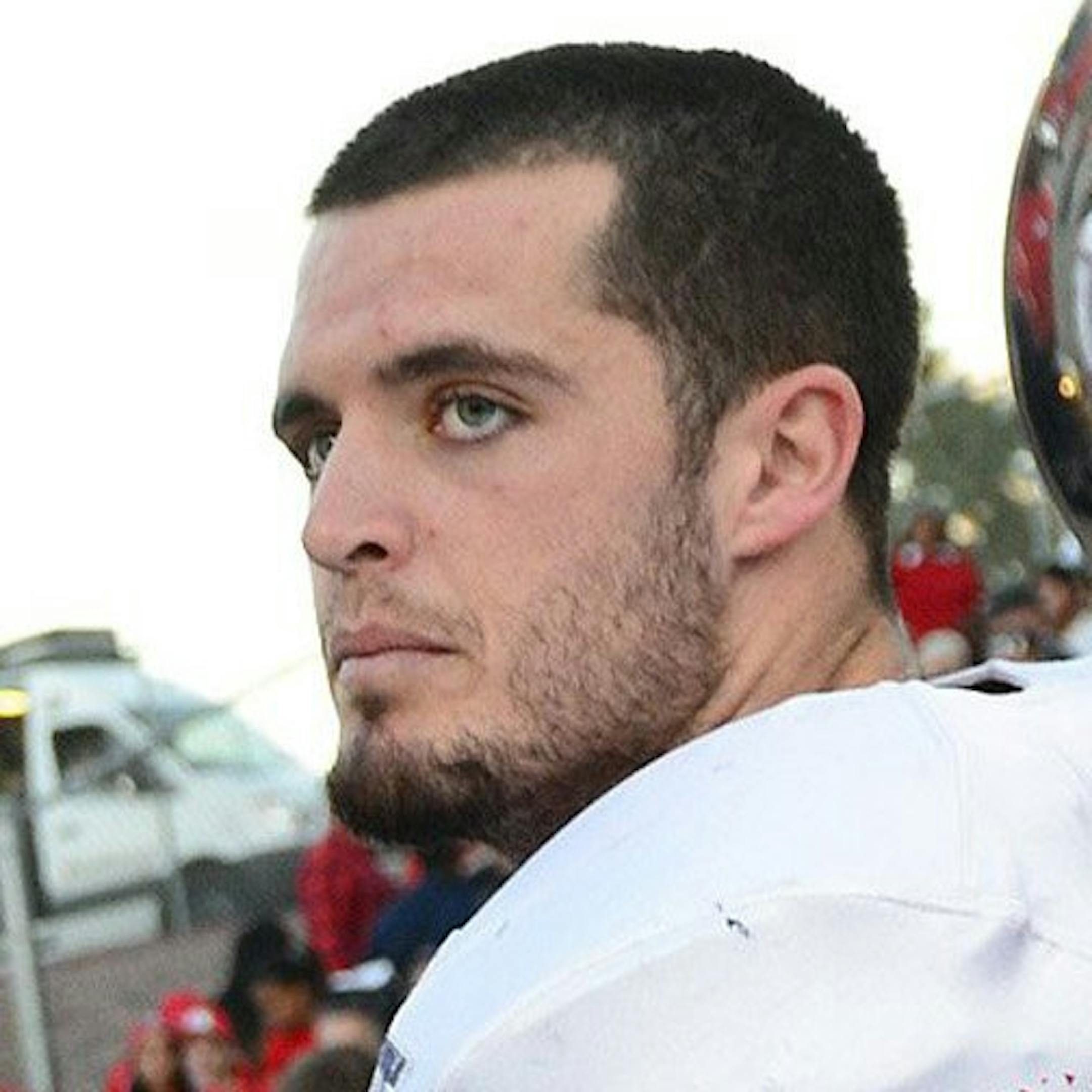 Former Fresno State star David Carr, left, has a brief word with his brother, Derek Carr, at the conclusion of the Royal Purple Las Vegas Bowl against USC at Sam Boyd Stadium in Las Vegas on Saturday, Dec. 21, 2013. USC won, 45-20. (Craig Kohlruss/Fresno Bee/MCT) ORG XMIT: 1147031