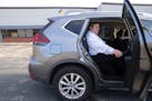 Elam Baer takes an Uber home from work at the Corporate Technologies Building in Eden Prairie on Friday. His newly formed rideshare firm, MyWeels, is 