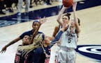 Connecticut guard Paige Bueckers (5) shoots against St. John's forward Rayven Peeples (20) during the first half of an NCAA college basketball game We