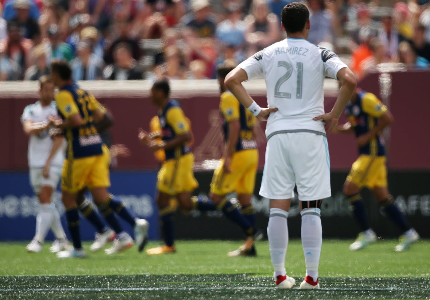 Minnesota United forward Christian Ramirez (21) watched as New York Red Bulls players celebrated a goal in the first half. ] ANTHONY SOUFFLE &#xef; anthony.souffle@startribune.com Game action from an MLS game between the Minnesota United and the New York Red Bulls Saturday, July 22, 2017 at TCF Bank Stadium in Minneapolis.