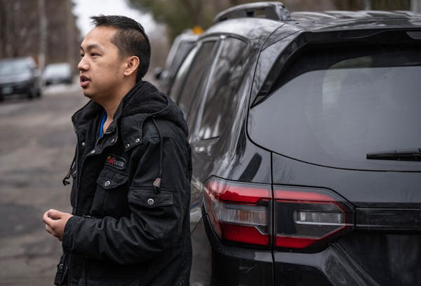 Pa Cheng Vang spoke to media outside his St. Paul home where firefighters responded to a fire around 1:30 a.m. Wednesday. His wife and six children we
