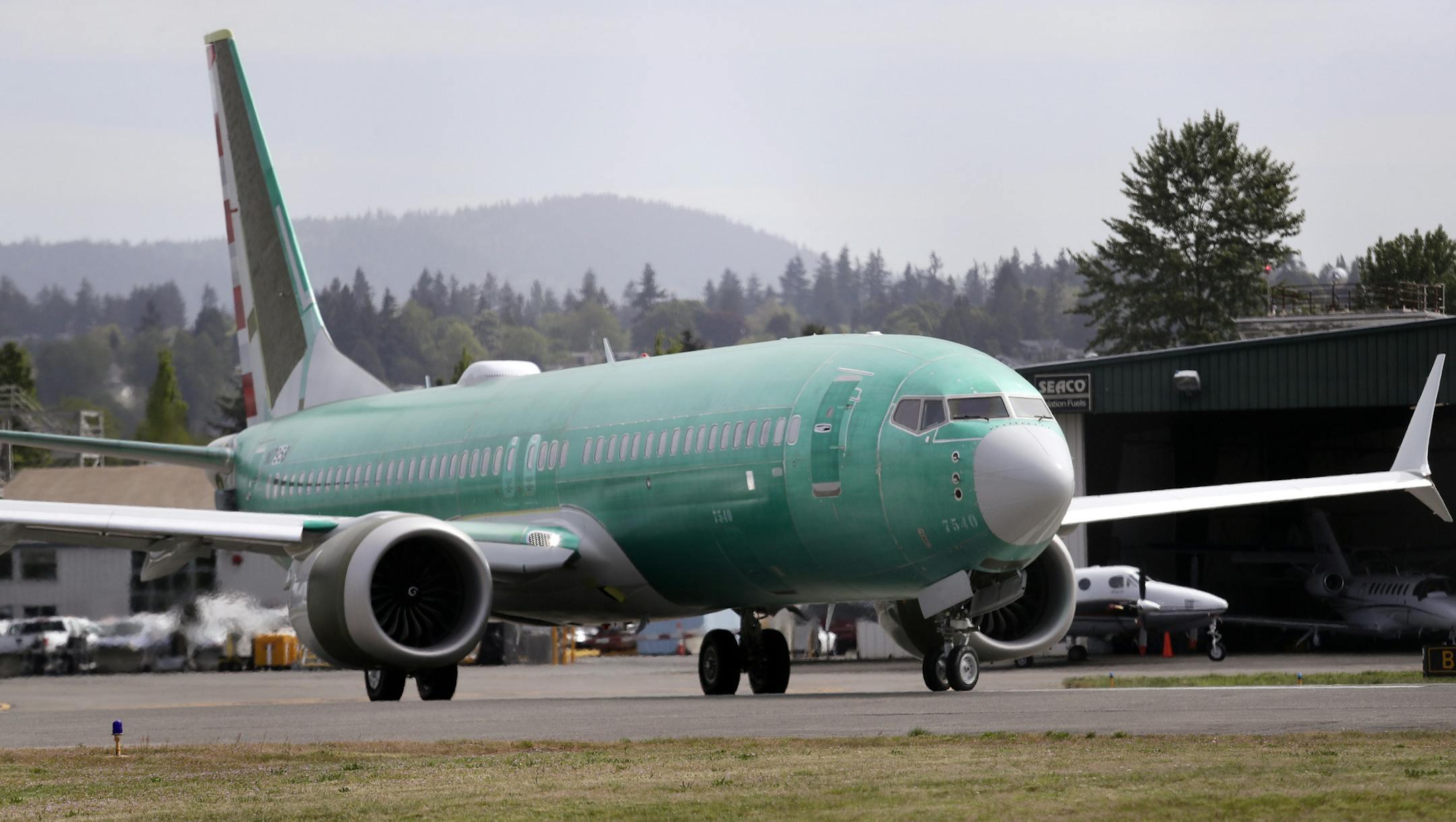 FILE - In this May 8, 2019, file photo a Boeing 737 MAX 8, being built for American Airlines, makes a turn on the runway as it's readied for takeoff on a test flight in Renton, Wash. American Airlines says it is delaying the expected return date for its Boeing 737 Max jets. The airline said Sunday, Sept. 1, that while it “remains confident” that coming software updates and training will mean recertification of the aircraft this year, it is extending cancellations for Max flights th