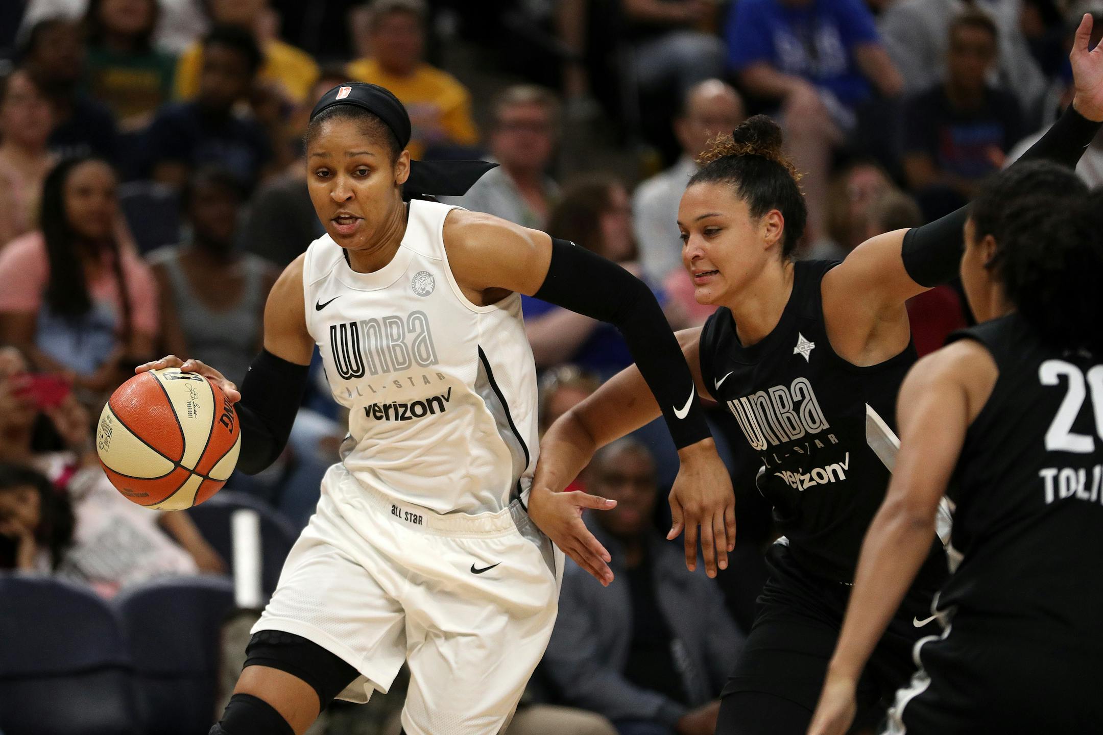 Team Parker forward Maya Moore (23) drove to the basket in the first half.