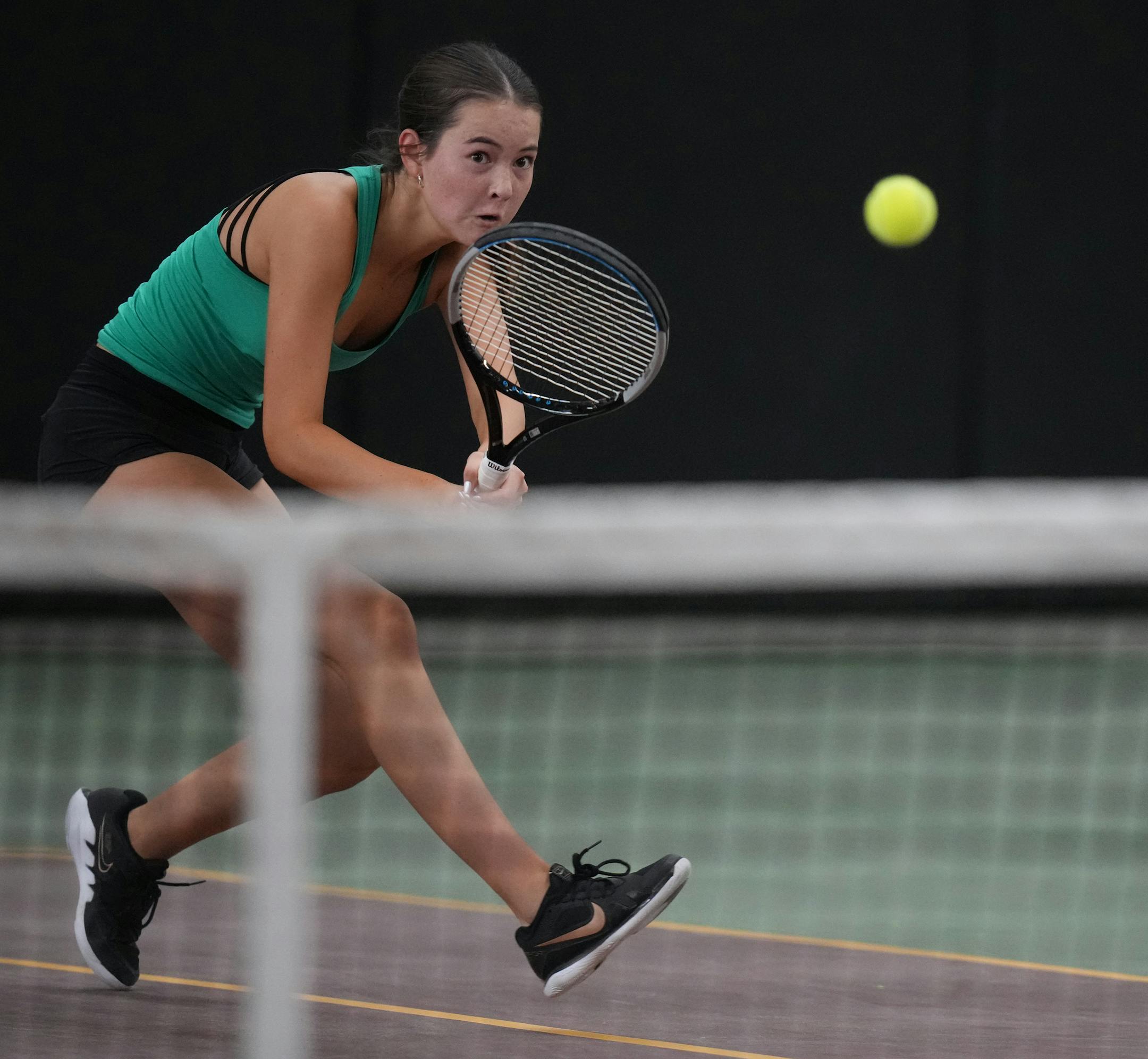 Aoife Loftus of Mayo returns a volley on the way to beating Astrid Kerrman of Edina at the Baseline Tennis Center in Minneapolis, Minnesota on Wednesday, Oct. 25, 2023.