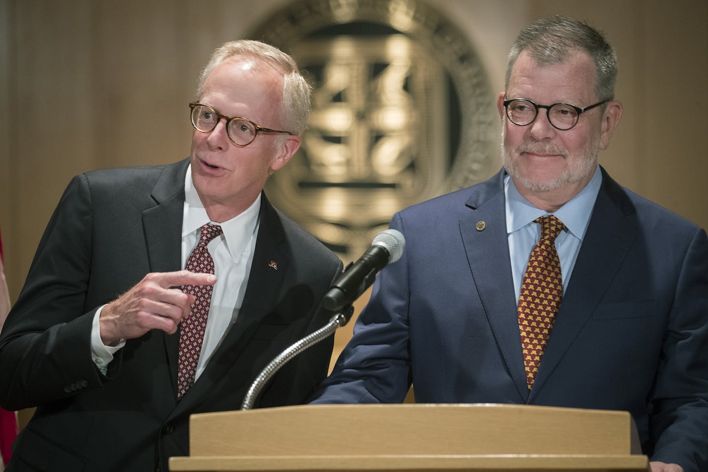 David McMillan Chair of the Board of Regents, left, and University of Minnesota President Eric Kaler took in a lighter moment after he announced to the media that he is leaving effective July 2019, during a press conference in the MacNamara Alumni Center, Friday, July 13, 2018 in Minneapolis, MN.