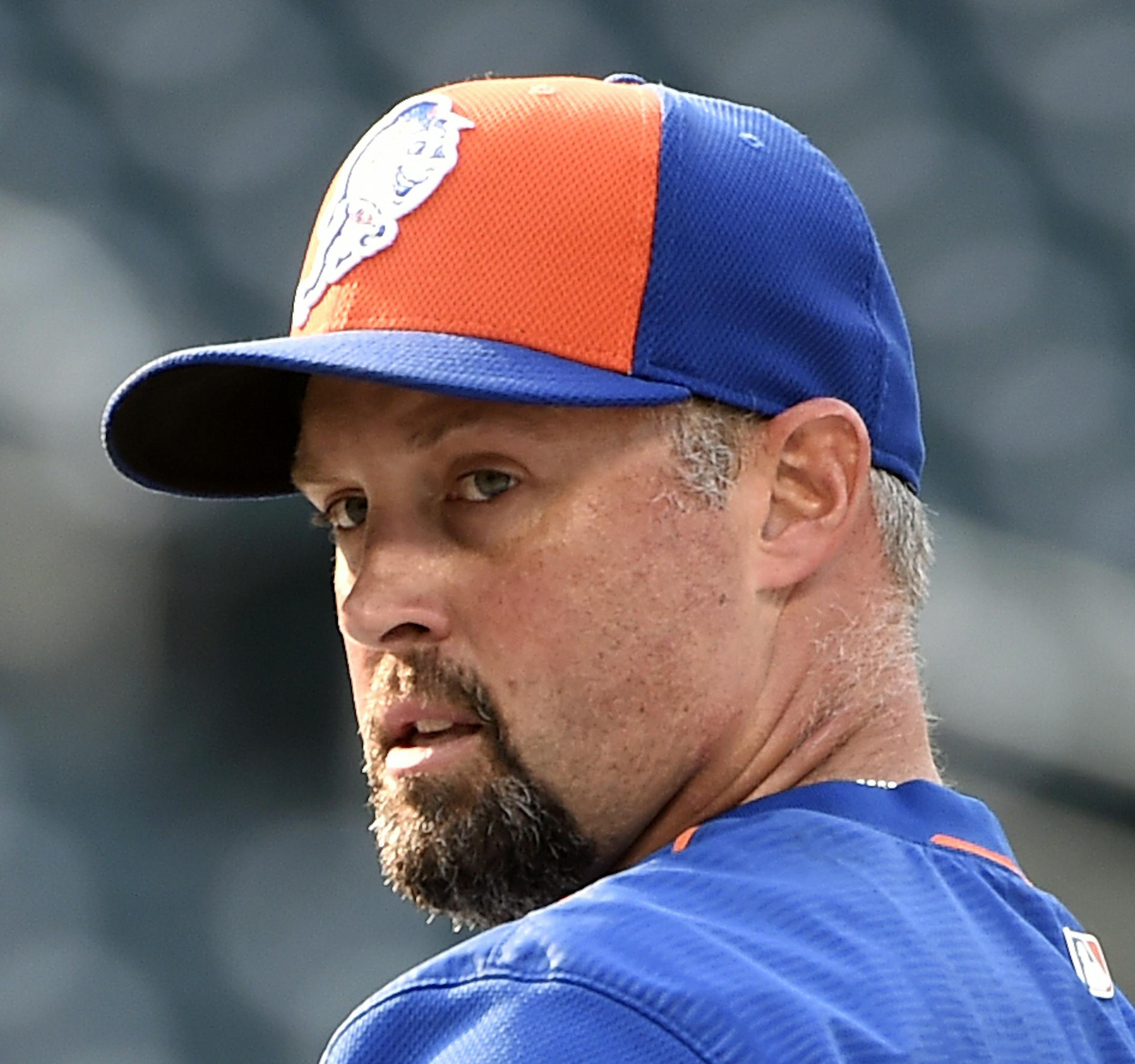 New York Mets left fielder Michael Cuddyer adjusts his gloves during batting practice before a baseball game against the Philadelphia Phillies at Citi Field on Wednesday, Sept. 2, 2015, in New York. (AP Photo/Kathy Kmonicek) ORG XMIT: MIN2015100223004965