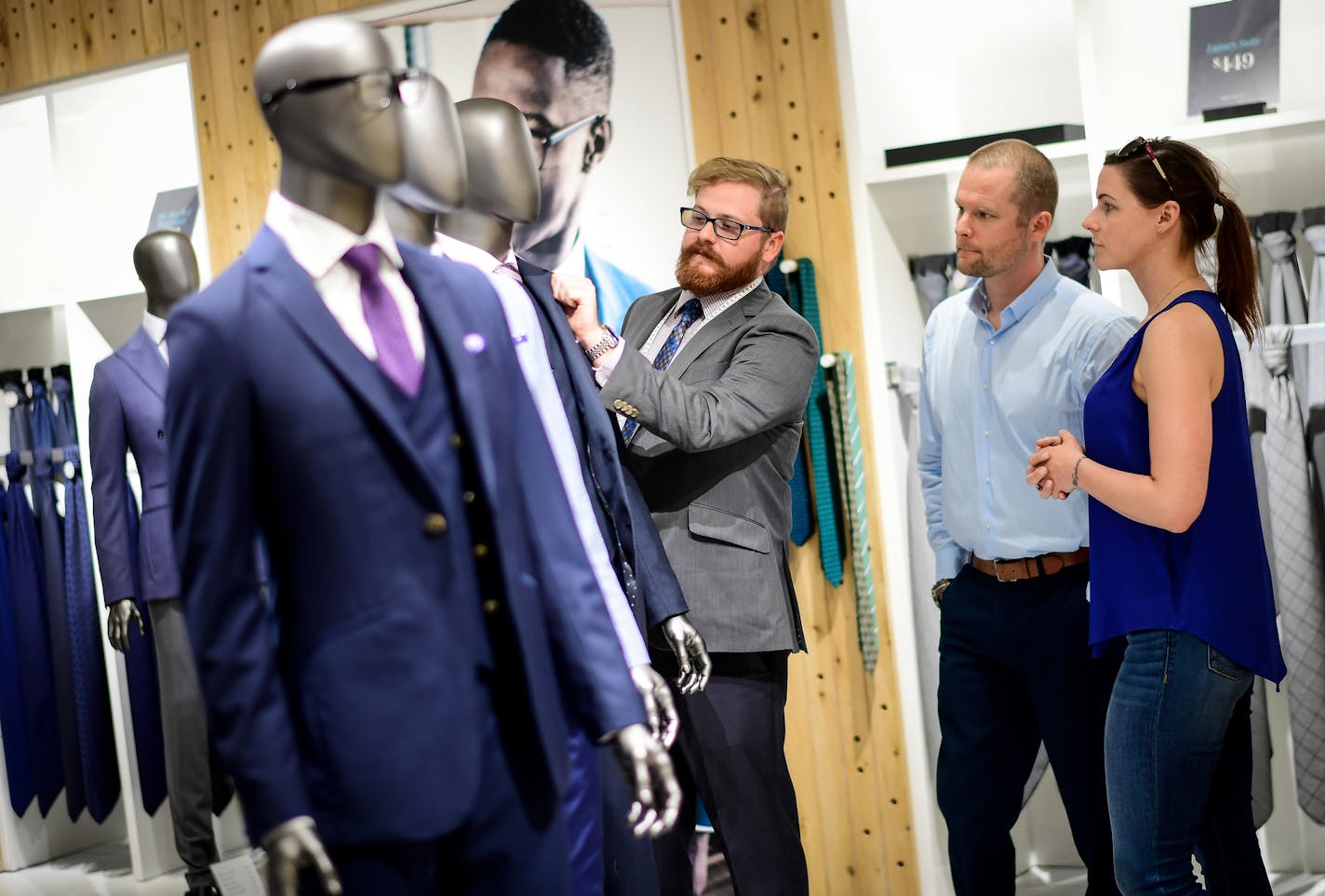 Indochino style guide Andrew Workman, left, helped Pat Morseth, of Minneapolis, shop for a custom suit for his wedding Wednesday night. Morseth's fiancee, Lauren Hoskinson, helped with the selection. ] AARON LAVINSKY &#xef; aaron.lavinsky@startribune.com Millennial men have shown more interest in looking dapper than their fathers or grandfathers. That explains why a chain of made-to-measure stores called Indochino has started opening around the country, including Mall of America. With a made to