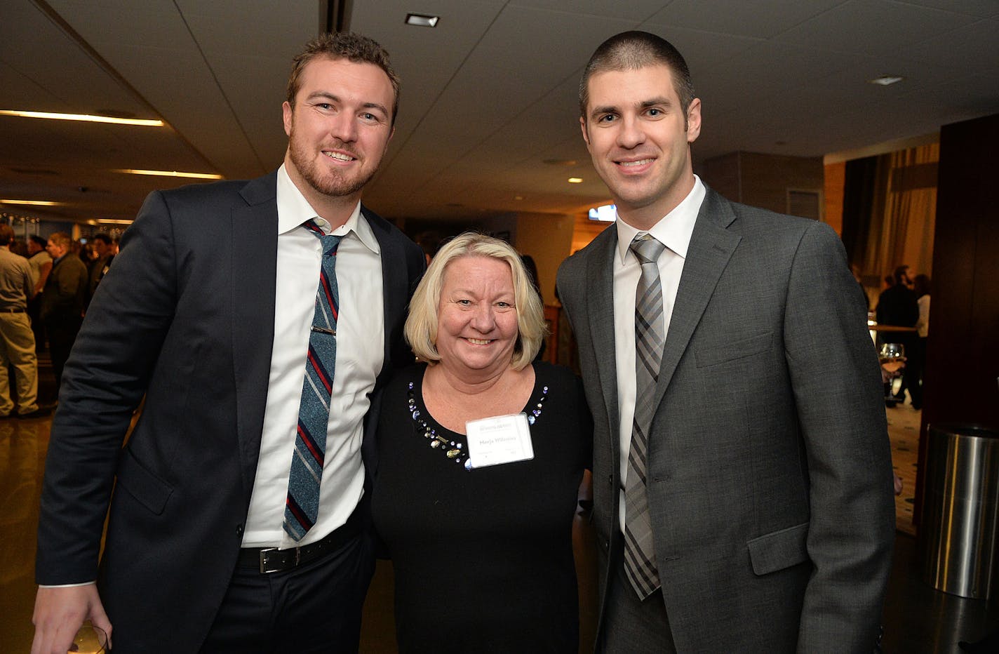 Recently signed Twins' pitcher Phil Hughes and homegrown favorite Joe Mauer take a photo with longtime season ticket-holder Merja Wilenius of Eagan Thursday night at the Diamond Awards at Target Field's Legends Club. ] (SPECIAL TO THE STAR TRIBUNE/BRE McGEE) **Phil Hughes (left), Merja Wilenius (center), Joe Mauer (right) ORG XMIT: MIN1401231950361724