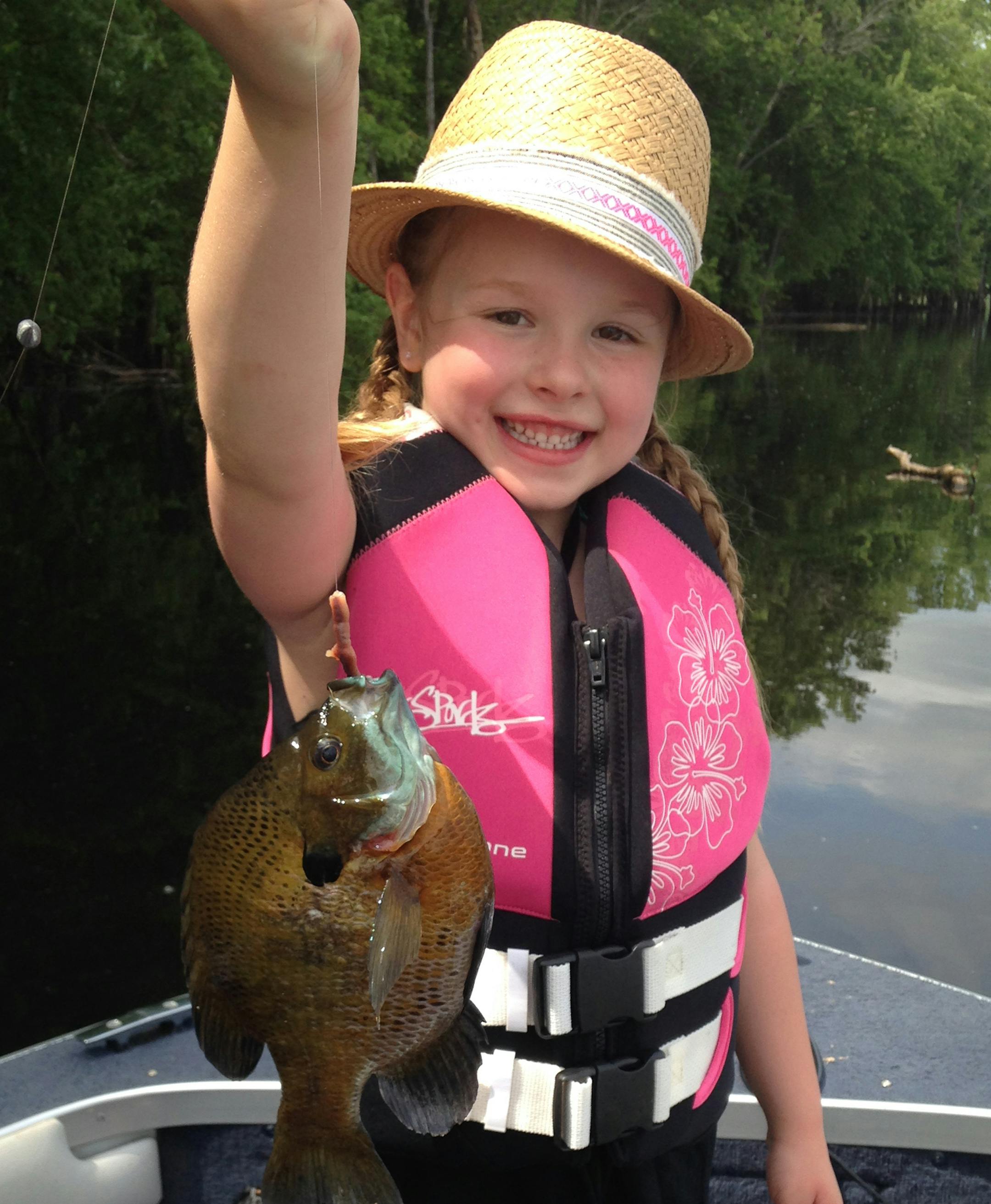 BIG SUNNIE Khloe Knudson, 5, of Andover, caught this 9 ¬Ω-inch sunfish on a night crawler on Lake Peltier in Lino Lakes while fishing with Grandpa Don Nyland of Blaine. "She could barely reel the fish in because it fought so hard!'' said Grandma Patty Nyland.