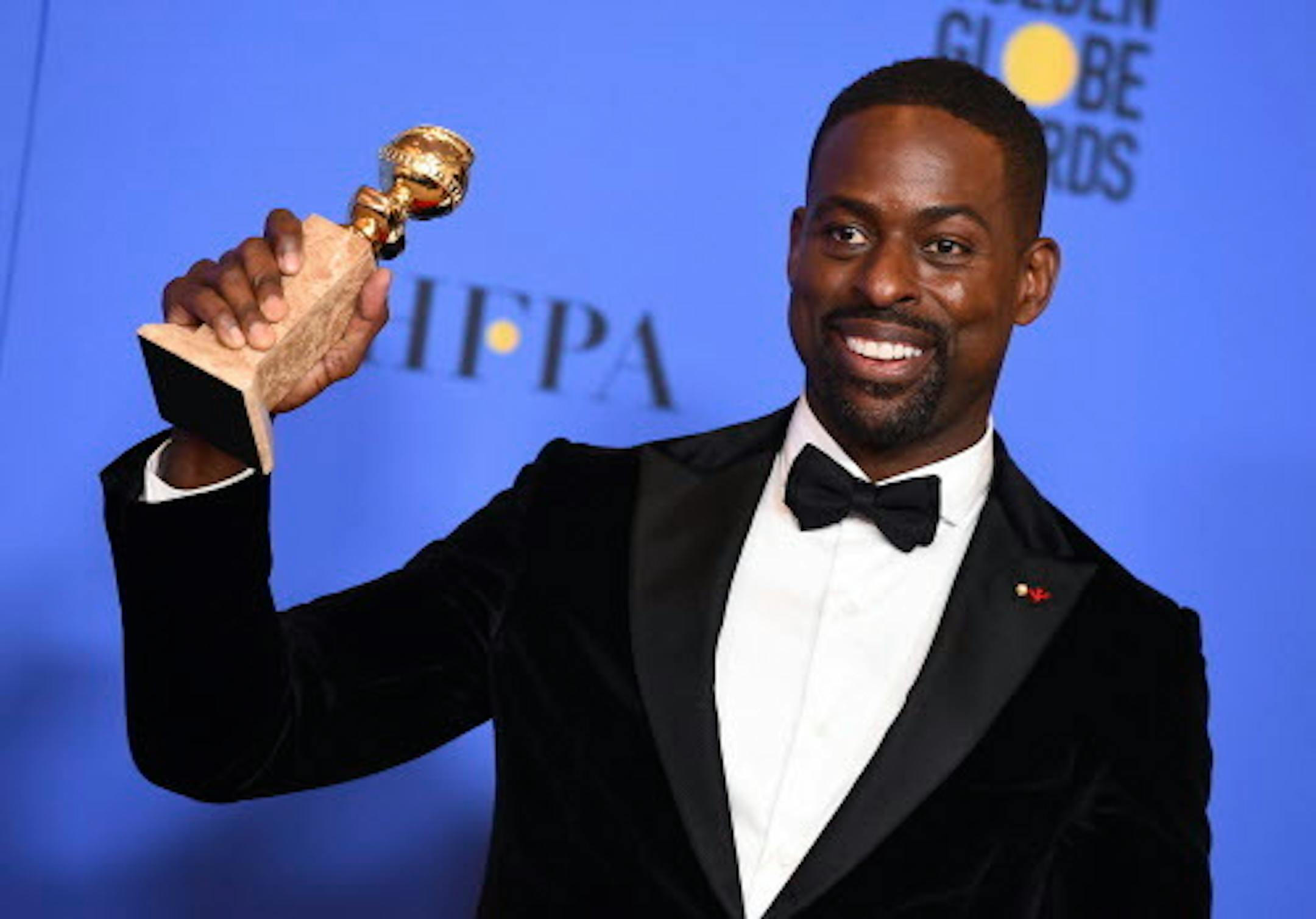 Sterling K. Brown poses in the press room with the award for best performance by an actor in a television series - drama for "This Is Us" at the 75th annual Golden Globe Awards at the Beverly Hilton Hotel on Sunday, Jan. 7, 2018, in Beverly Hills, Calif. (Photo by Jordan Strauss/Invision/AP)