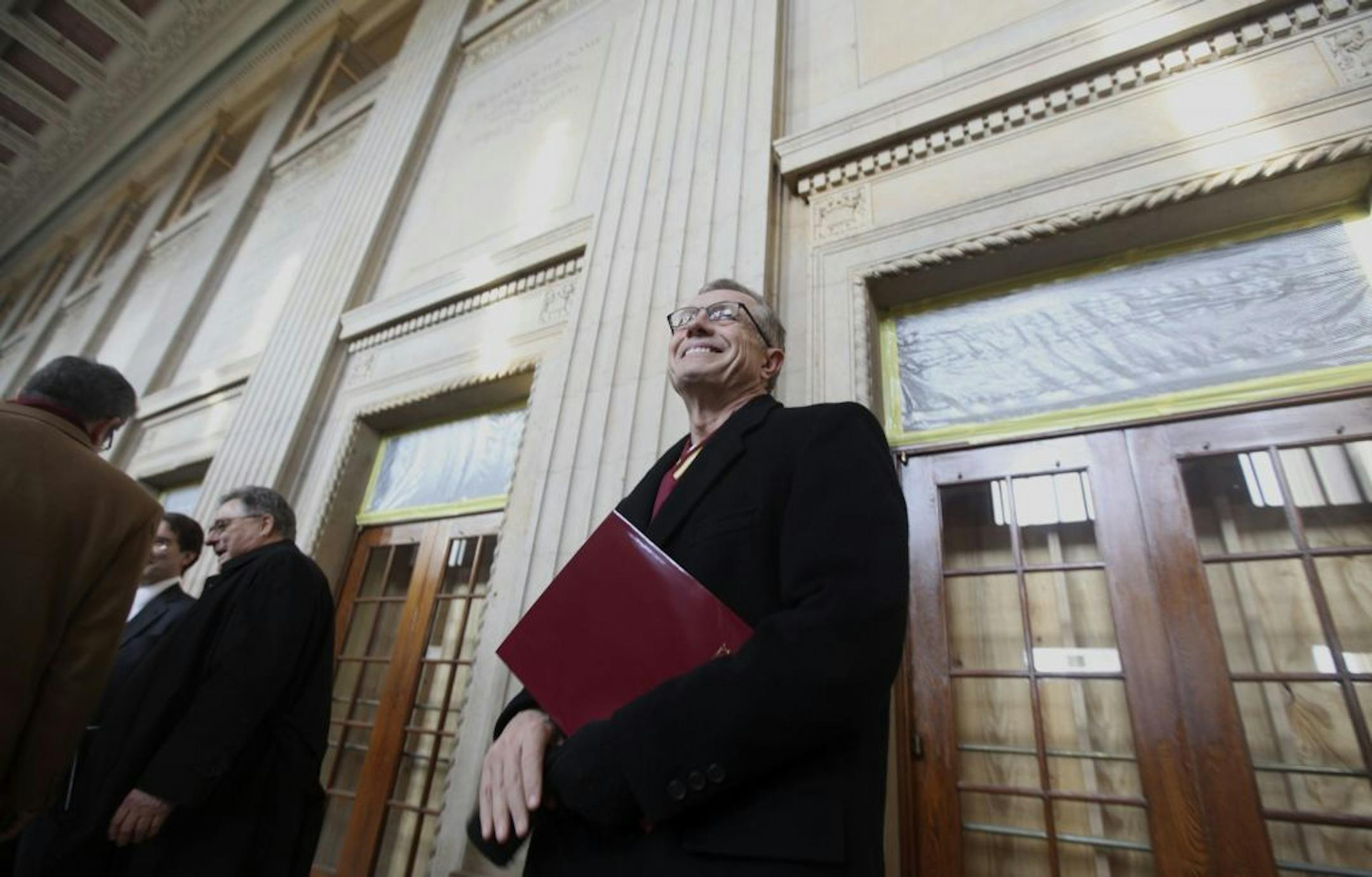 Regent Steve Sviggum looked around the entrance before starting a tour of Northrup Auditorium in Minneapolis Min., Thursday, February 9, 2012.