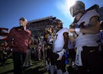 Minnesota Gophers head coach PJ Fleck lined up with his players before taking the field before Wednesday's game against the Auburn Tigers. ] Aaron Lav