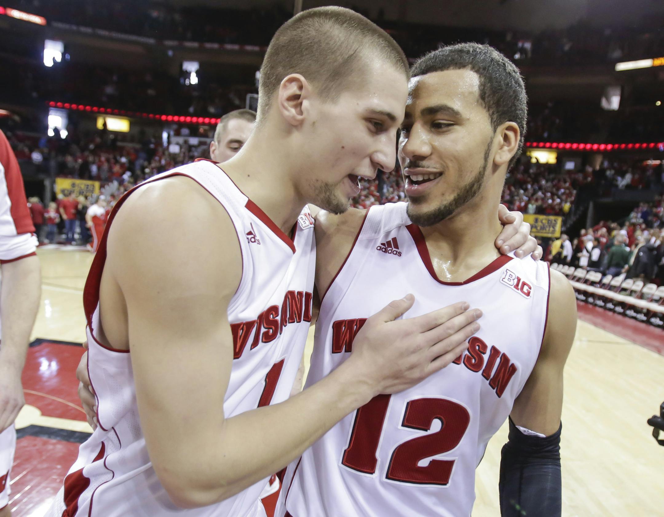 Wisconsin's Ben Brust, left, and Traevon Jackson celebrate after they defeated Michigan State 60-58 in an NCAA college basketball game on Sunday, Feb. 9, 2014, in Madison, Wis. Jackson made the game-winning basket in the final seconds of play. (AP Photo/Andy Manis)