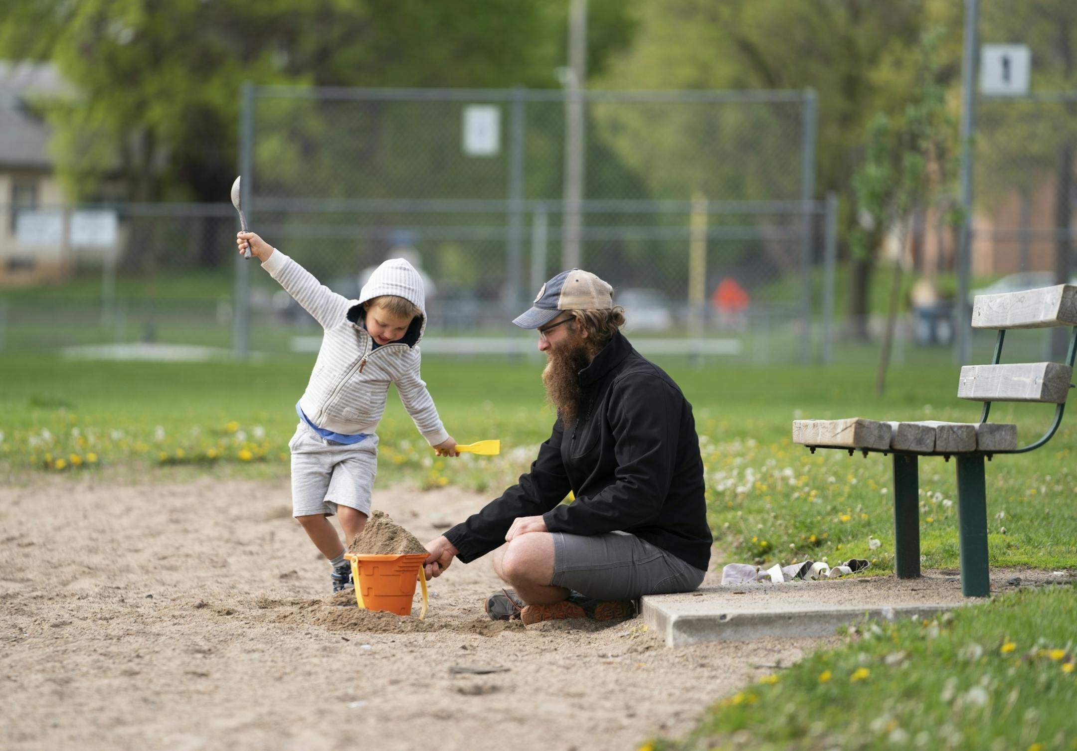 Simeon Martin, 4, played in the sand with his dad Westin Martin at the volleyball court at Martin Luther King Jr. Park in Minneapolis, Minn., on Tuesday, May 21, 2019. The two were giving Simeon's mom, who is overdue with a baby, a break.