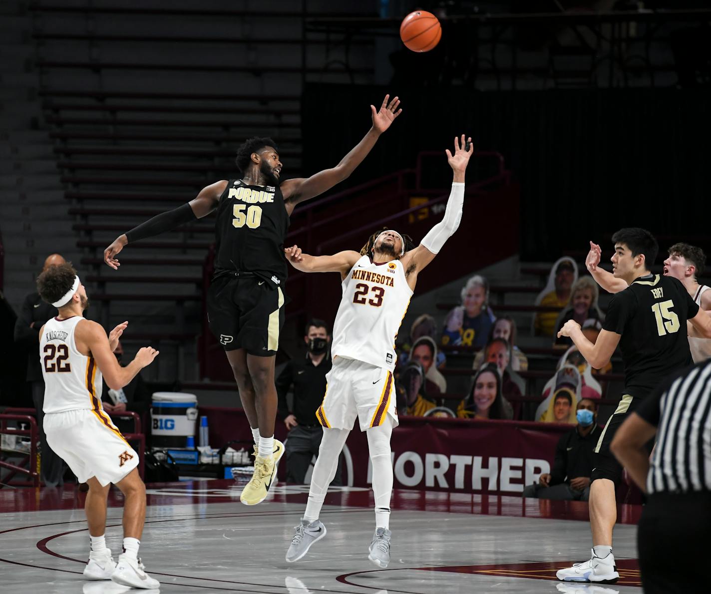 Purdue forward Trevion Williams leapt for an inbound pass with Brandon Johnson of the Gophers.