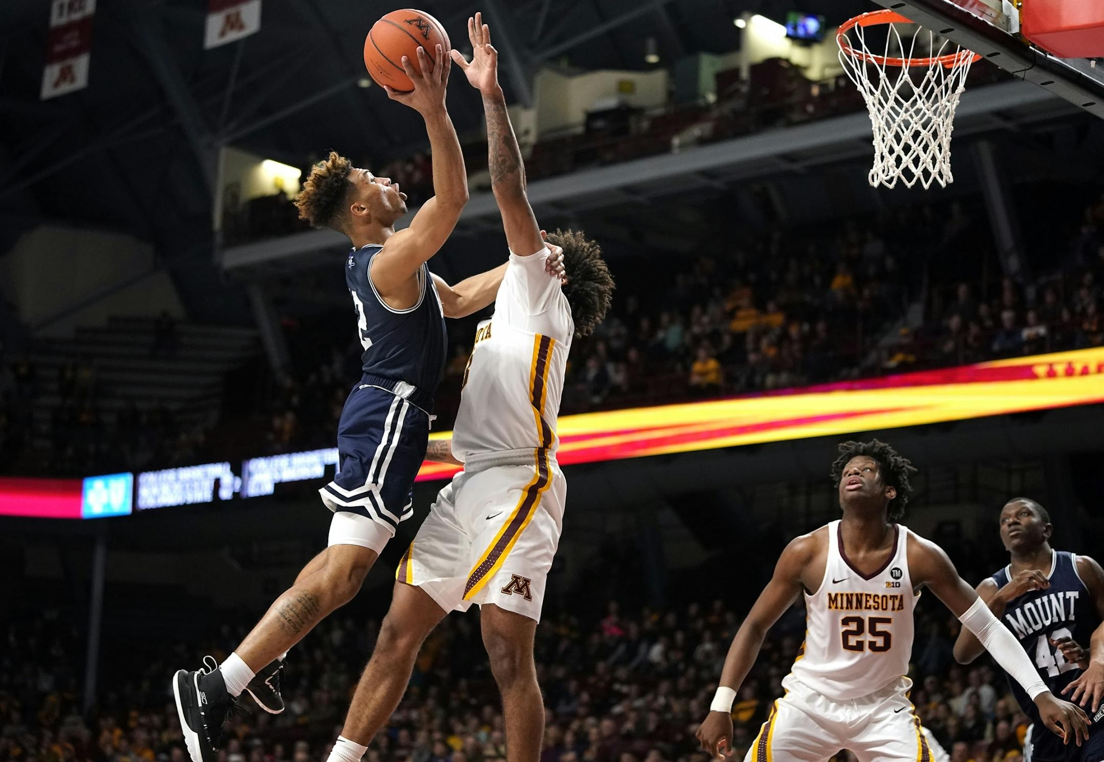 Mount St. Mary's guard Dee Barnes (2) shoots against Minnesota forward Jordan Murphy (3) during the second half.